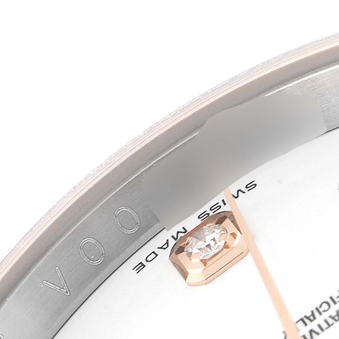 The image shows a close-up of the dial and part of the bezel of a Rolex Datejust 116231 Men's Steel and Gold (two tone) White Dial 116231 Men's Steel and Gold (two tone) White Dial watch, highlighting the "Swiss Made" text and a diamond marker.