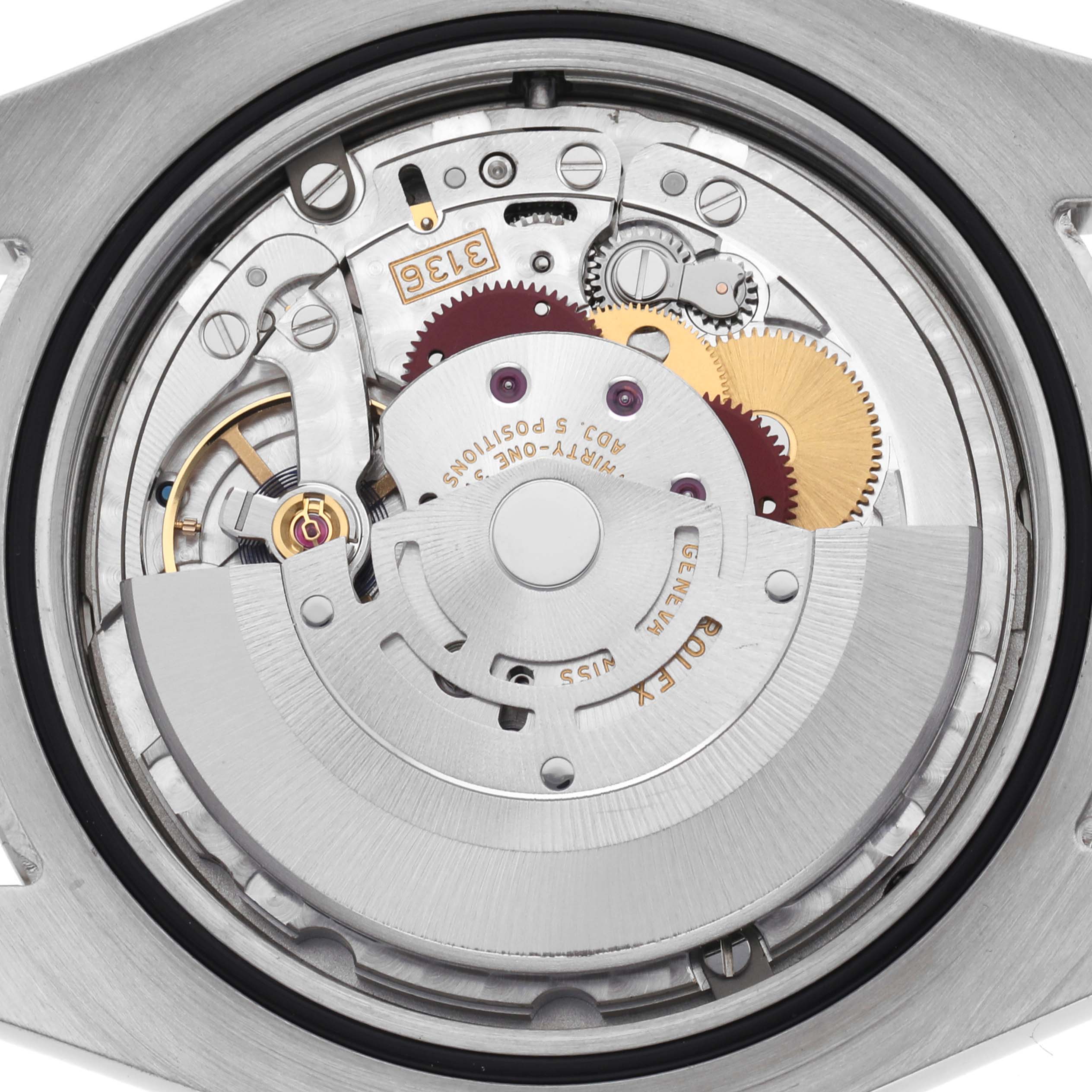 The image shows the inner mechanism of a Rolex Datejust 41 116334 Men's Stainless Steel Blue Dial 116334 Men's Stainless Steel Blue Dial, including gears, cogs, and the rotor, at a straight-on angle.