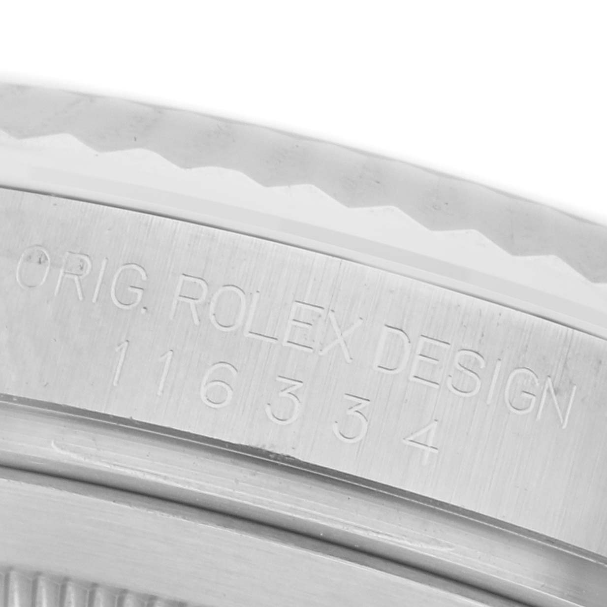 The image shows a close-up of the side of a Rolex Datejust 41 116334 Men's Stainless Steel Blue Dial 116334 Men's Stainless Steel Blue Dial, focusing on the engraved model number.