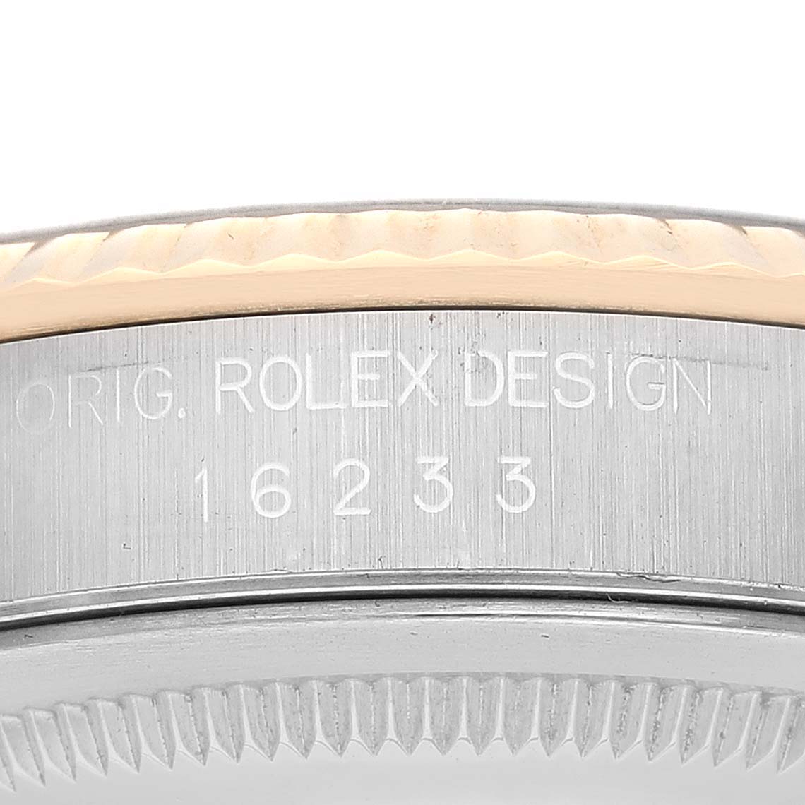This image shows a close-up of the side of the case of a Rolex Datejust 16233 Men's Steel and Gold (two tone) Black Dial 16233 Men's Steel and Gold (two tone) Black Dial watch, displaying the engraved Rolex design and model number.