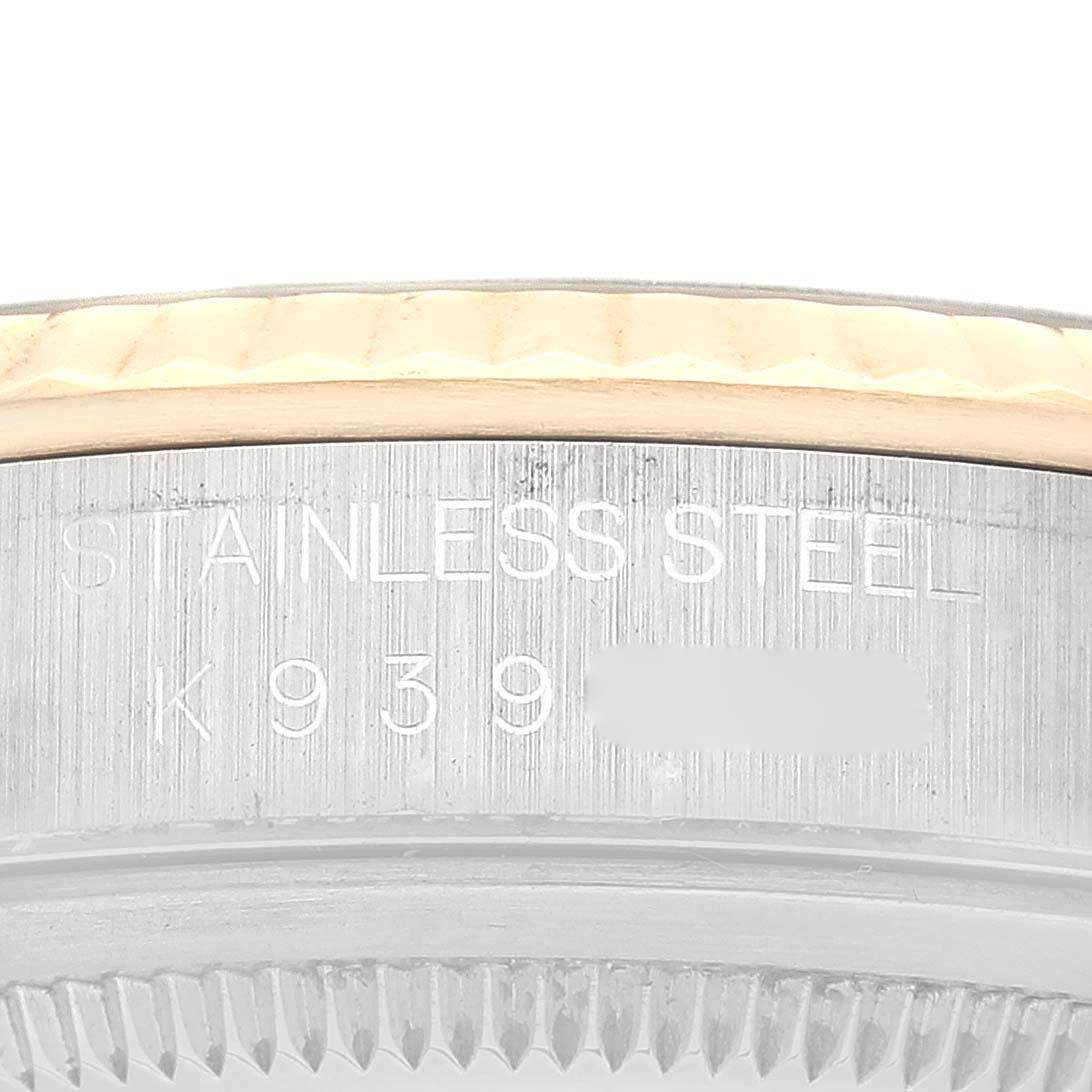 The image shows a close-up of the case side and part of the bezel of a Rolex Datejust 16233 Men's Steel and Gold (two tone) Black Dial 16233 Men's Steel and Gold (two tone) Black Dial, revealing the stainless steel engraving.