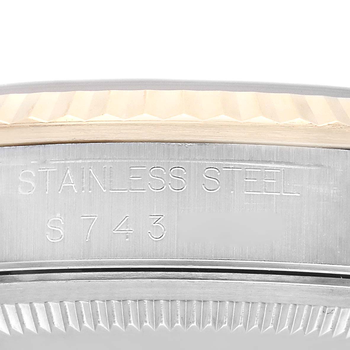 The image shows a close-up of the side engraving on a stainless steel Rolex Datejust 16233 Men's Steel and Gold (two tone) Champagne Dial 16233 Men's Steel and Gold (two tone) Champagne Dial watch case.
