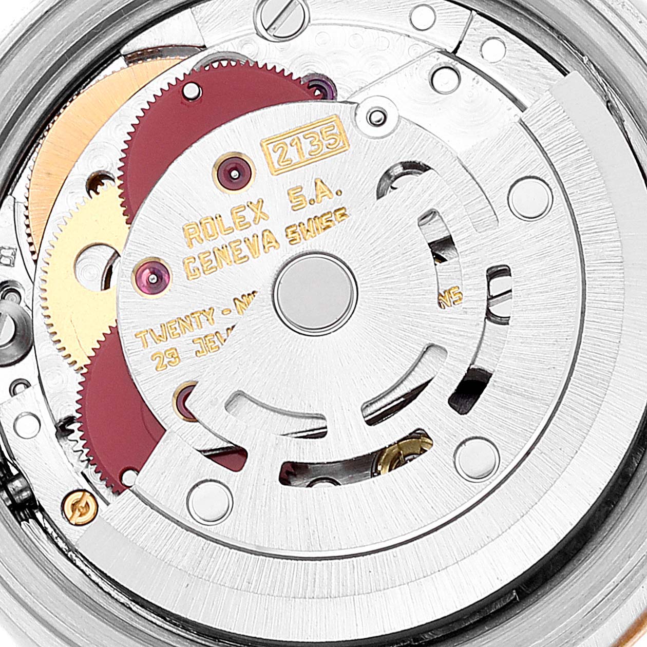 The image shows a close-up view of the Rolex Datejust 69173 Women's Steel and Gold (two tone) Champagne Dial 69173 Women's Steel and Gold (two tone) Champagne Dial watch movement, highlighting the gears, rotor, and inscriptions.