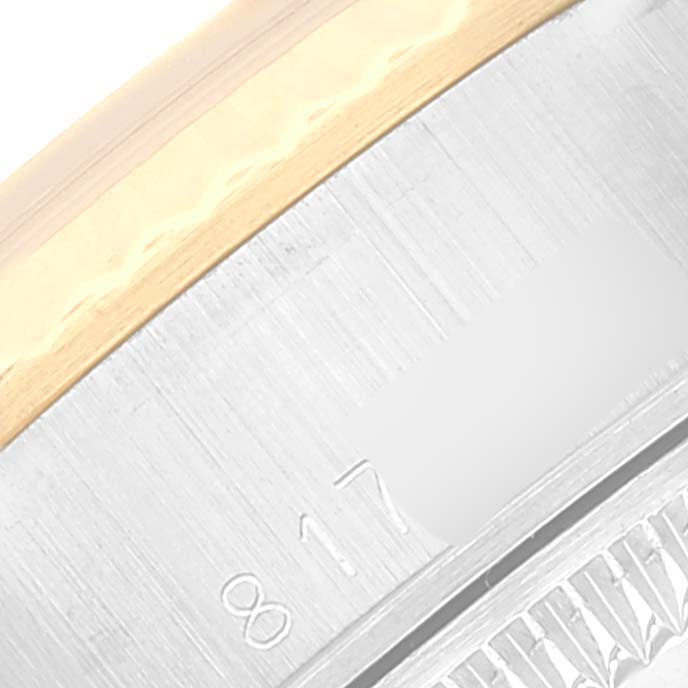 This image shows a close-up of the engraved details and part of the bezel of the Rolex Datejust 69173 Women's Steel and Gold (two tone) Champagne Dial 69173 Women's Steel and Gold (two tone) Champagne Dial model watch.