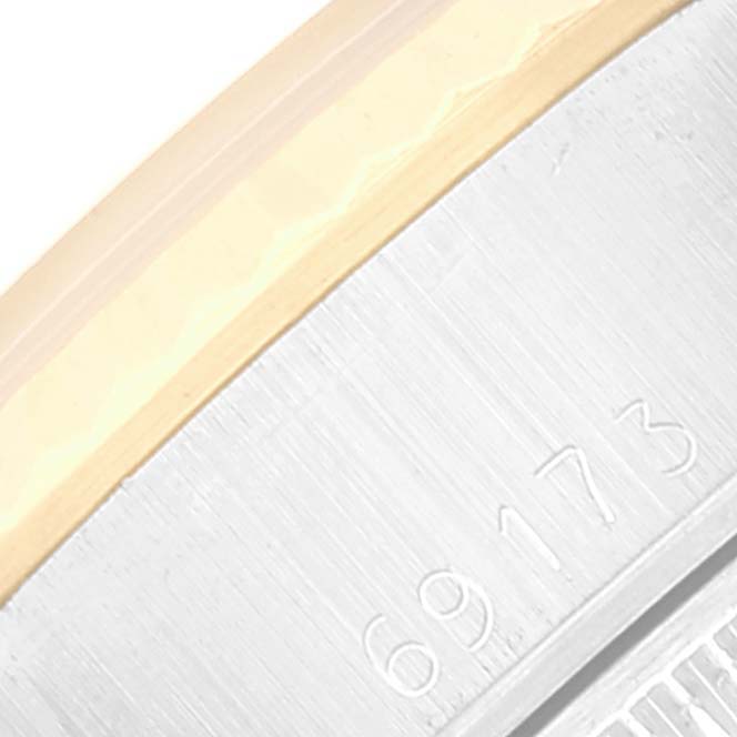 This close-up angle of the Rolex Datejust 69173 Women's Steel and Gold (two tone) Champagne Dial 69173 Women's Steel and Gold (two tone) Champagne Dial model shows a portion of the bezel and the reference number "69173" on the side.