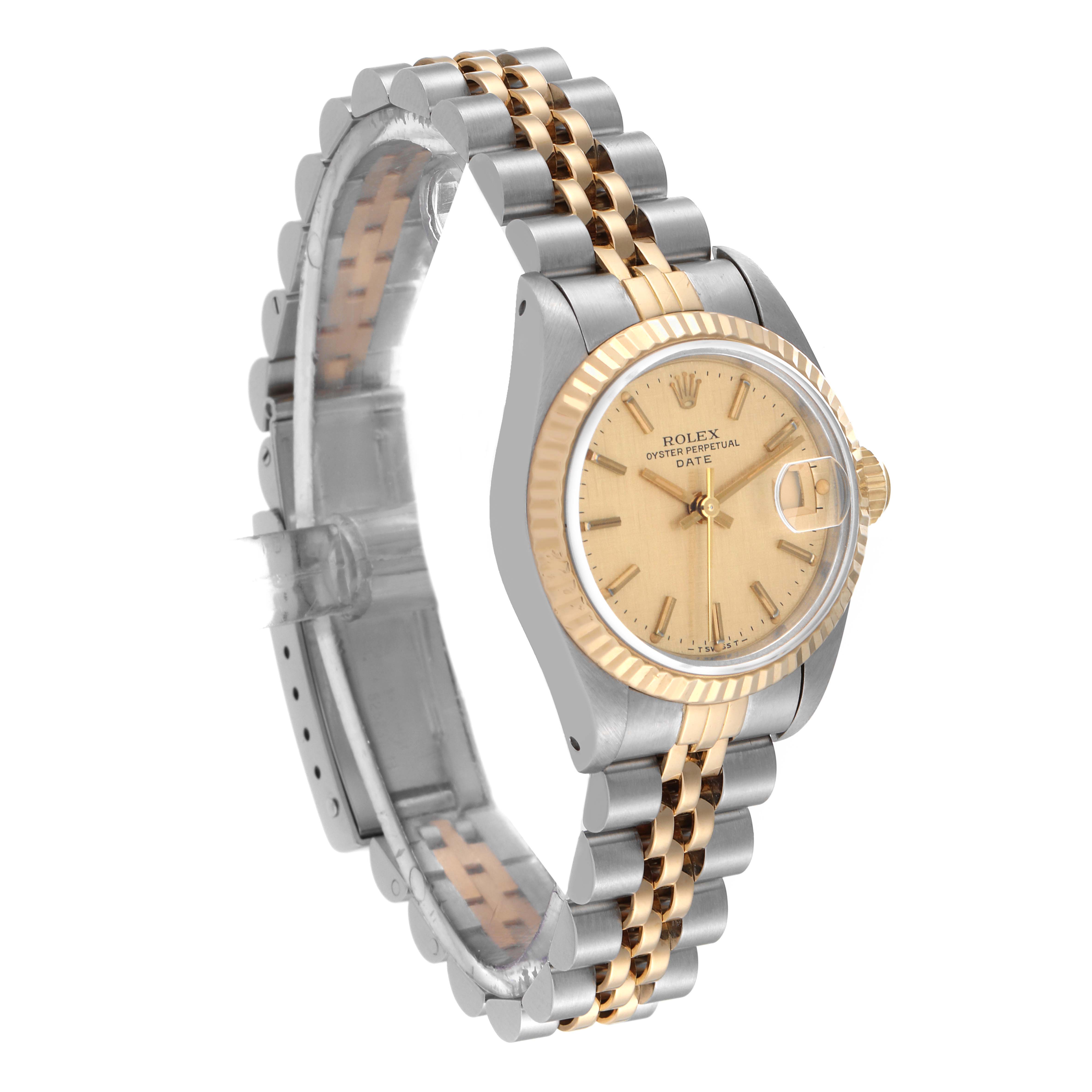 The image shows a Rolex Datejust 69173 Women's Steel and Gold (two tone) Champagne Dial 69173 Women's Steel and Gold (two tone) Champagne Dial watch from an oblique angle showing the face, case, and jubilee bracelet.