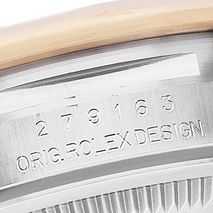 The image shows a close-up angle of the serial number engraving on the case of a Rolex Datejust 279163 Women's Steel and Gold (two tone) Silver Dial 279163 Women's Steel and Gold (two tone) Silver Dial.