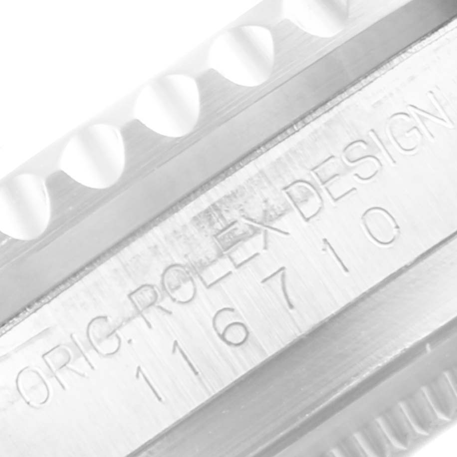 The image shows an angled close-up of the bezel and model number engraving on a Rolex GMT-Master 116710 Men
s Stainless Steel Black Dial 116710 Men
s Stainless Steel Black Dial watch.