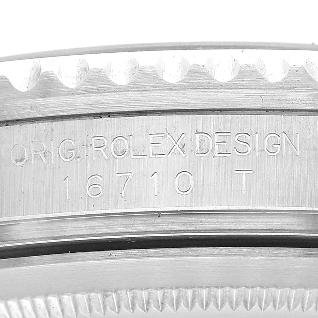 The image shows a close-up of the case side and bezel of a Rolex GMT-Master 16710 Men
s Stainless Steel Black Dial 16710 Men
s Stainless Steel Black Dial model, with the engraving "ORIG. ROLEX DESIGN 16710 T."