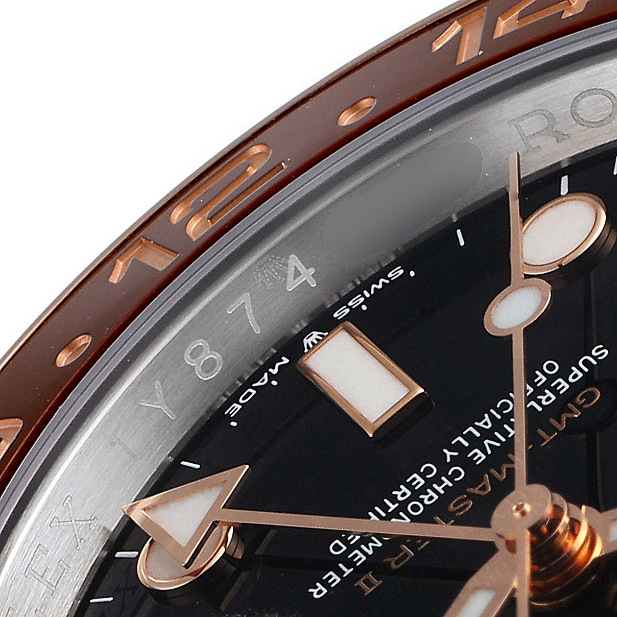 This image shows a close-up of the bezel, dial, and hands of a Rolex GMT-Master 126711 Men
s Steel and Gold (two tone) Black Dial 126711 Men
s Steel and Gold (two tone) Black Dial watch.