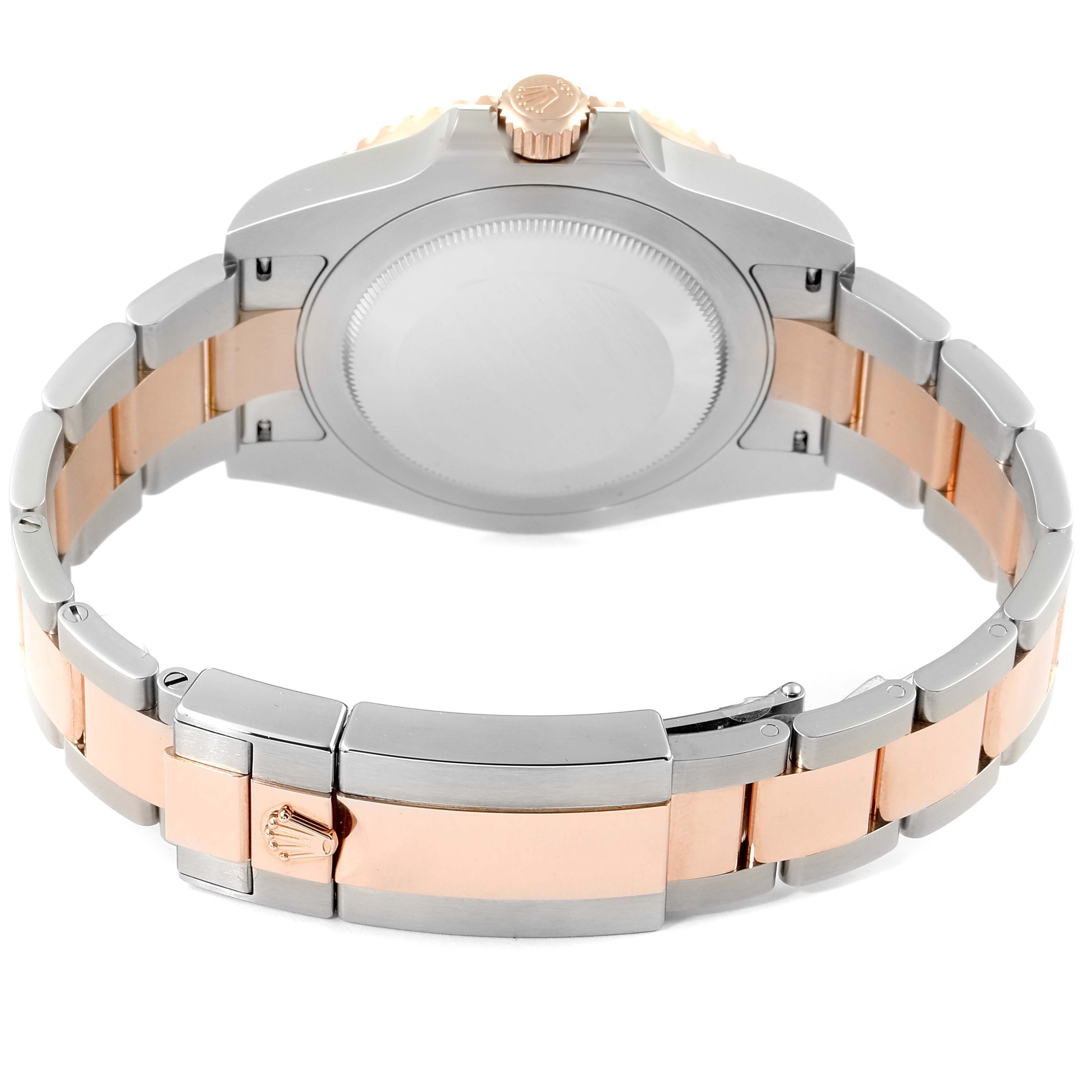 This image shows the back view of a Rolex GMT-Master 126711 Men
s Steel and Gold (two tone) Black Dial 126711 Men
s Steel and Gold (two tone) Black Dial watch, highlighting its bracelet and clasp.