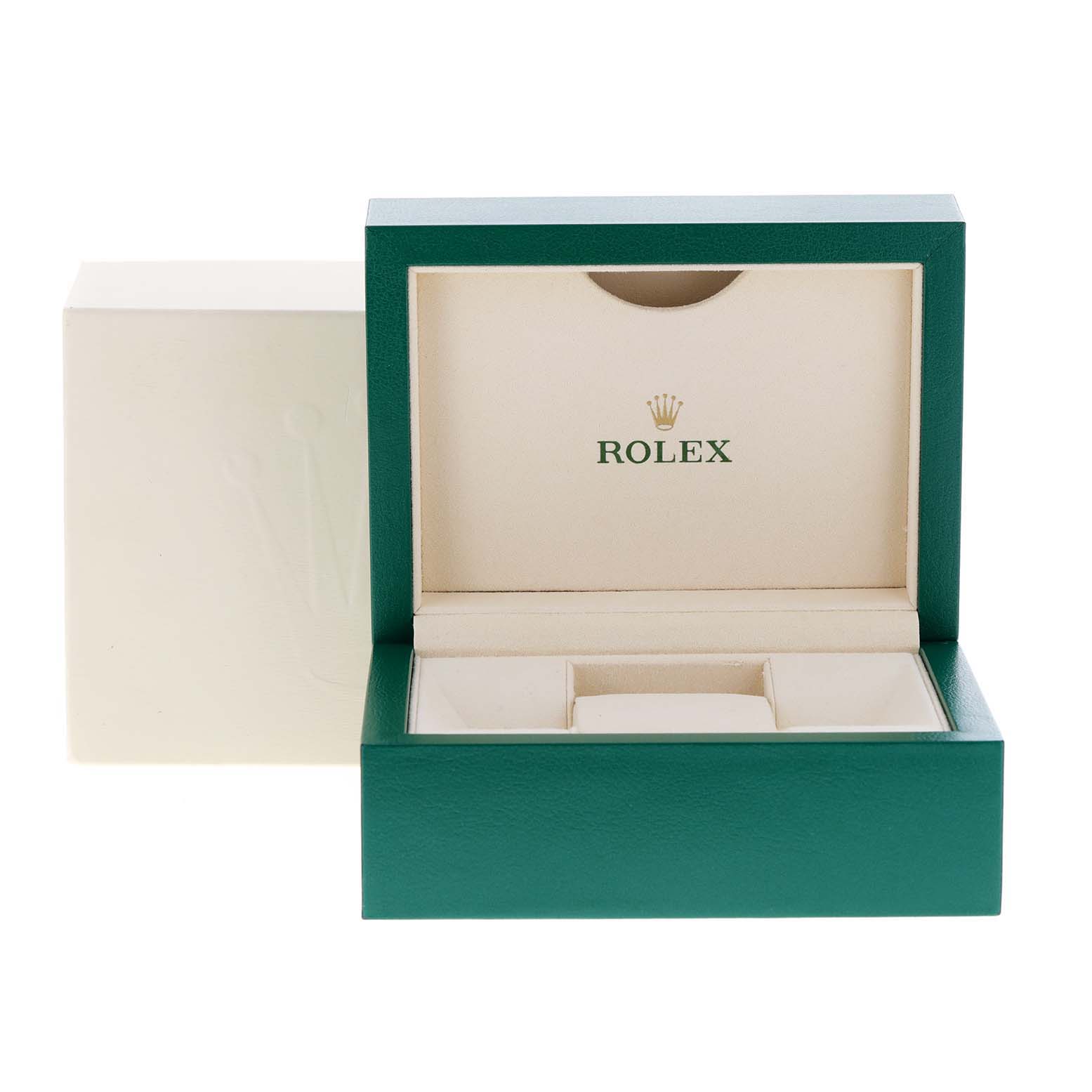 This image shows an empty Rolex Mid-Size 177200 Women
s Stainless Steel Silver Dial 177200 Women
s Stainless Steel Silver Dial model watch box with its green exterior and beige interior.