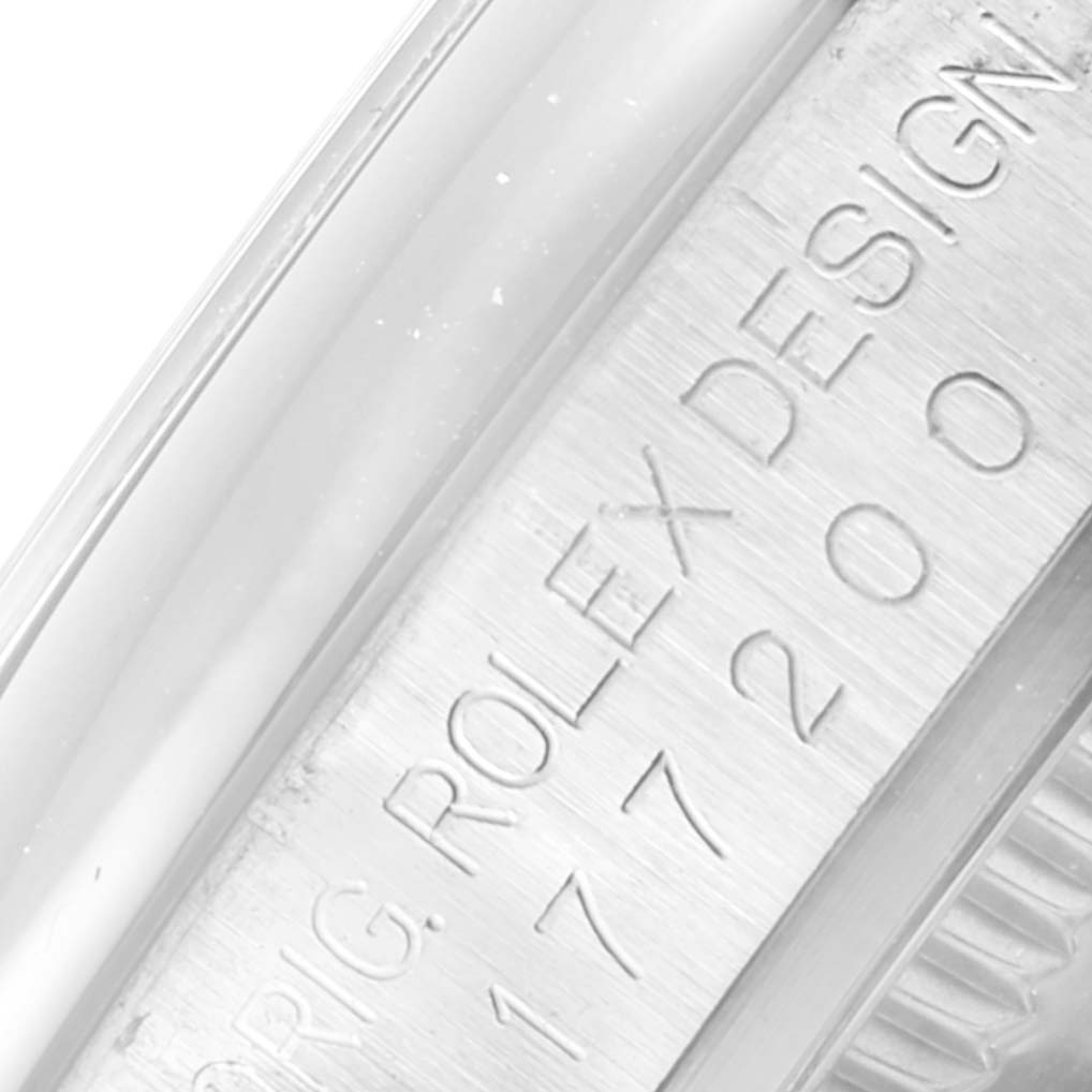 This close-up image of a Mid-Size Rolex watch shows the engraved inner bezel and part of the case.