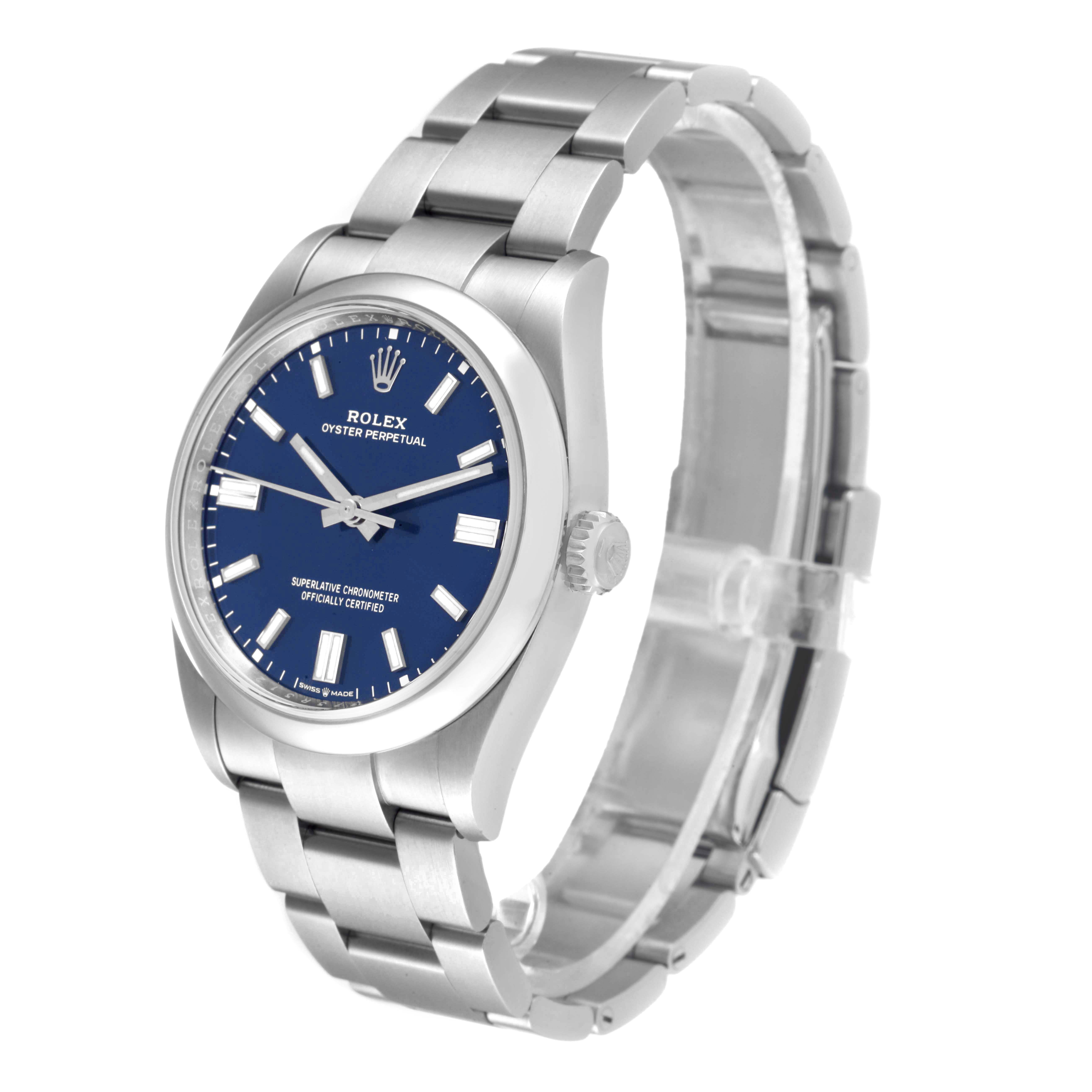 The image shows a three-quarters view of the Rolex Oyster Perpetual 126000 Men's Stainless Steel Blue Dial 126000 Men's Stainless Steel Blue Dial watch featuring its blue dial and stainless steel bracelet.