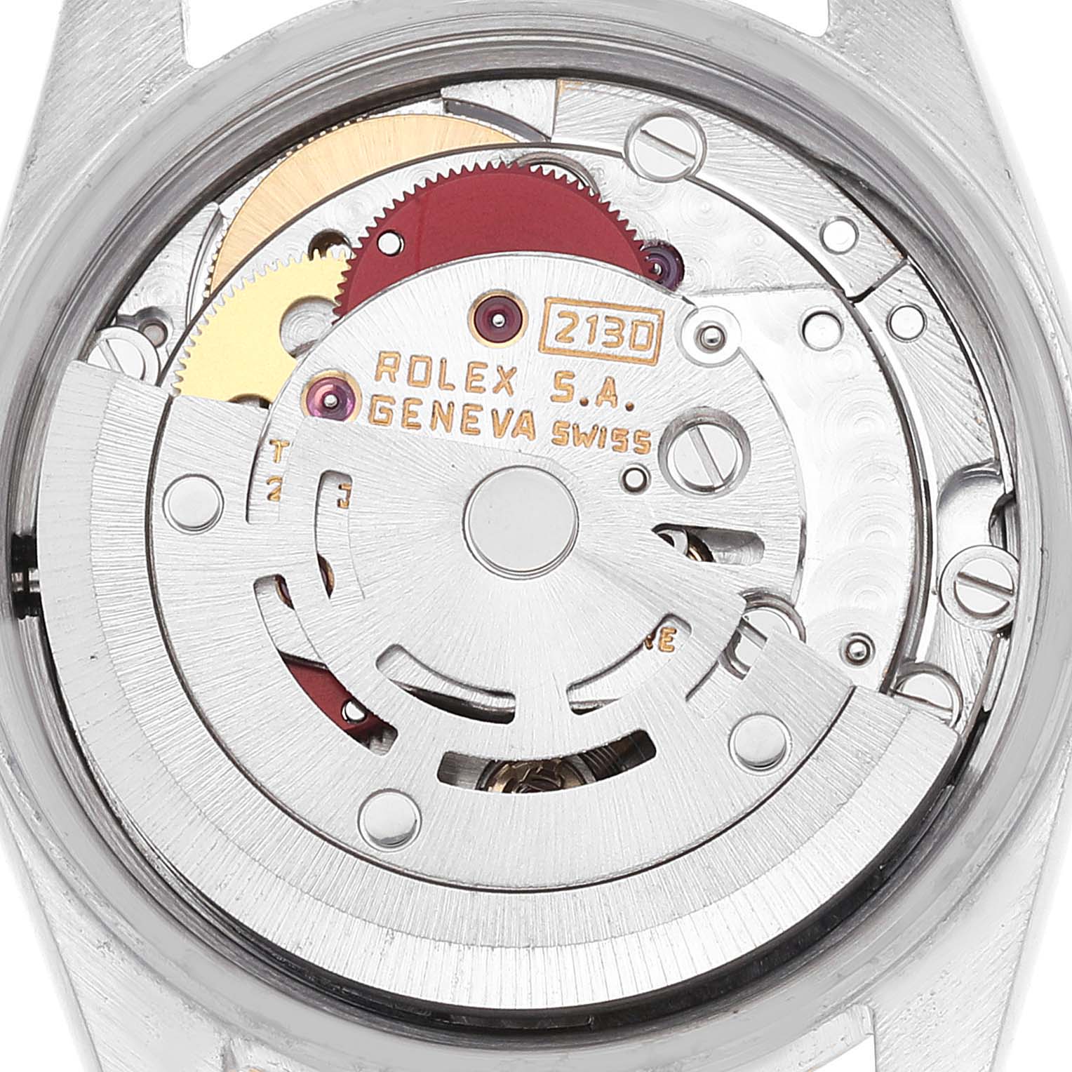 This is a close-up view of the Rolex Oyster Perpetual 67193 Women's Steel and Gold (two tone) Champagne Dial 67193 Women's Steel and Gold (two tone) Champagne Dial watch's internal mechanism, showing the intricate gears and rotor.