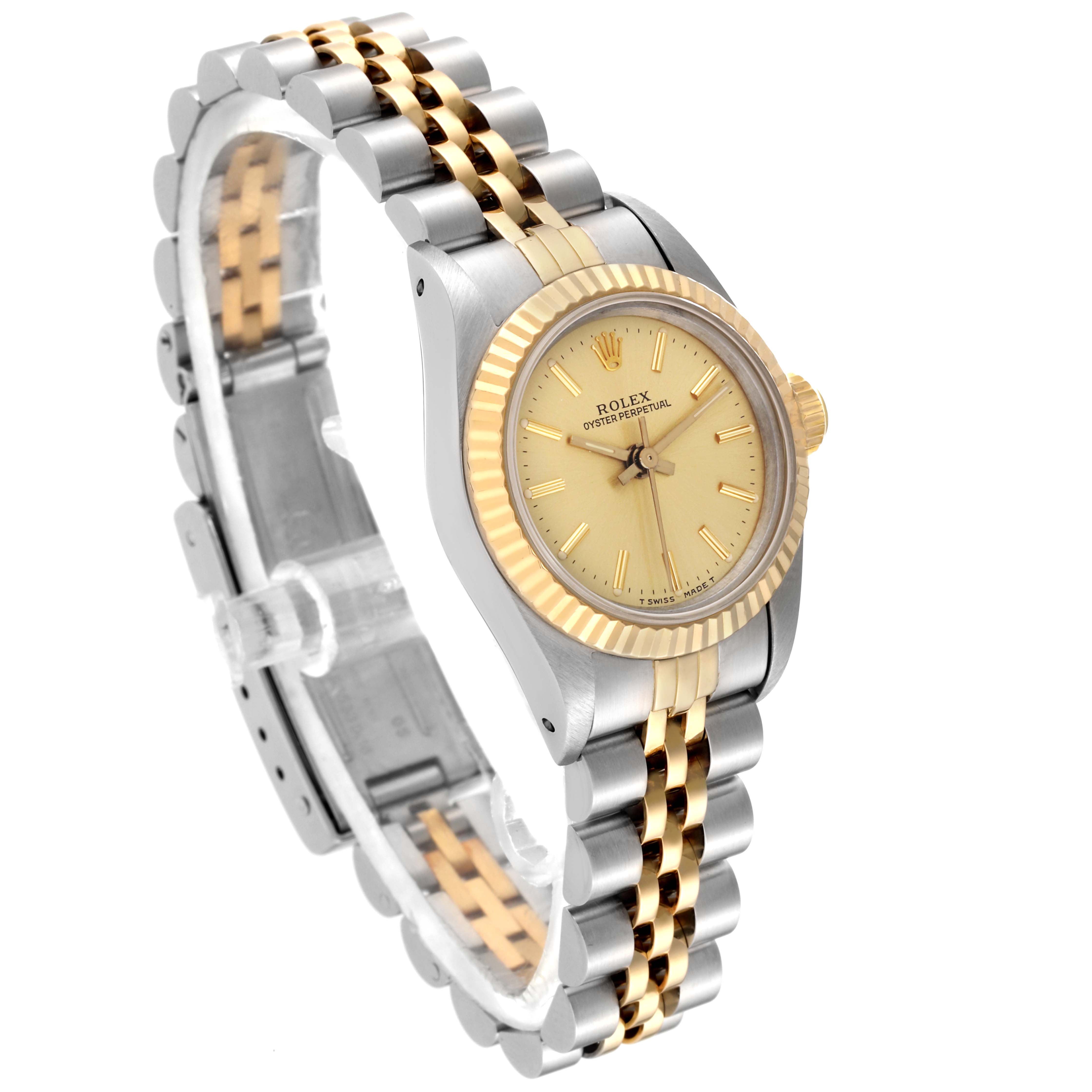 The image shows a Rolex Oyster Perpetual 67193 Women's Steel and Gold (two tone) Champagne Dial 67193 Women's Steel and Gold (two tone) Champagne Dial watch at a slight angle, highlighting its two-tone bracelet and fluted bezel.