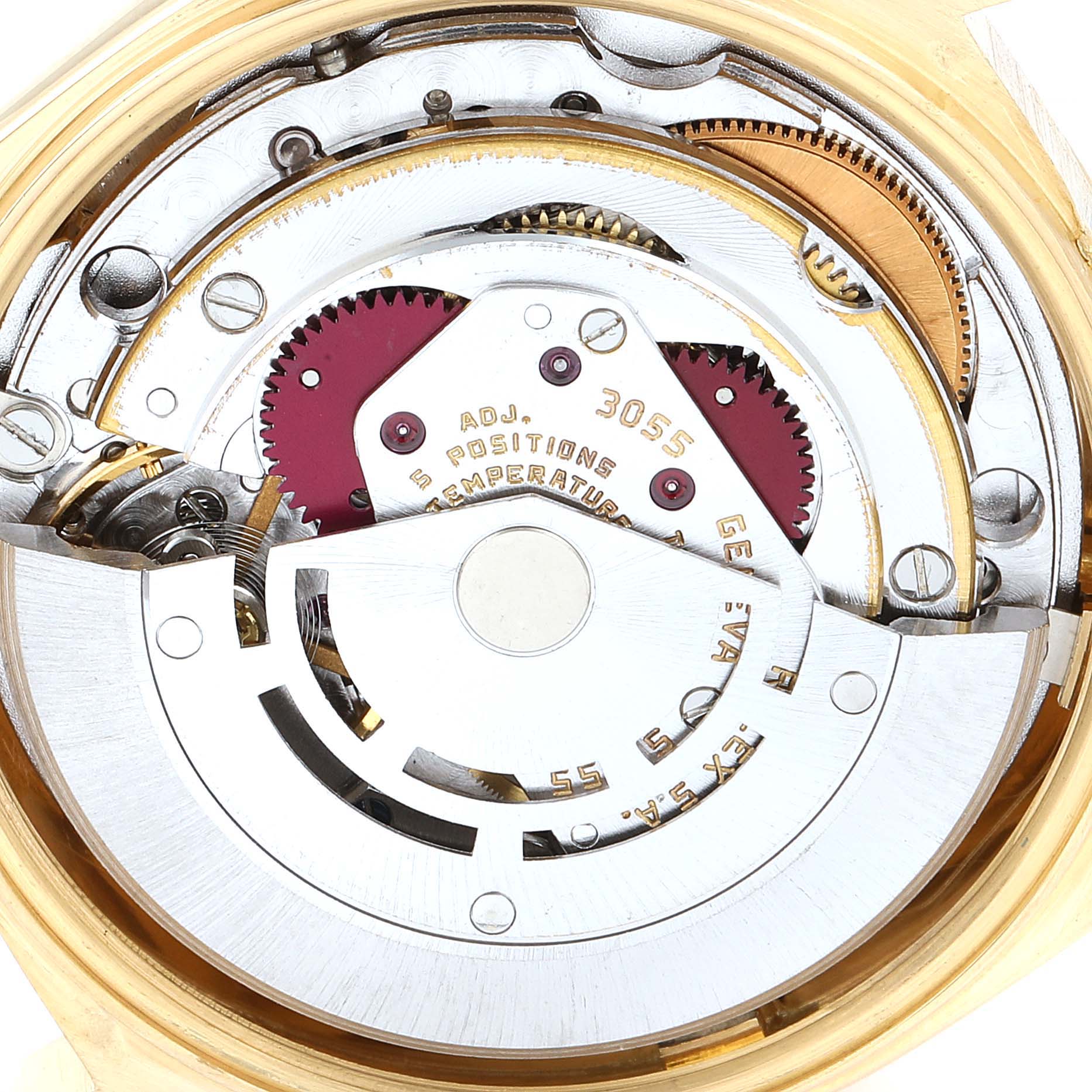 This image shows a close-up view of the inner mechanism of a Rolex President 18038 Men's Yellow Gold White Dial 18038 Men's Yellow Gold White Dial model watch, highlighting gears and intricate components.