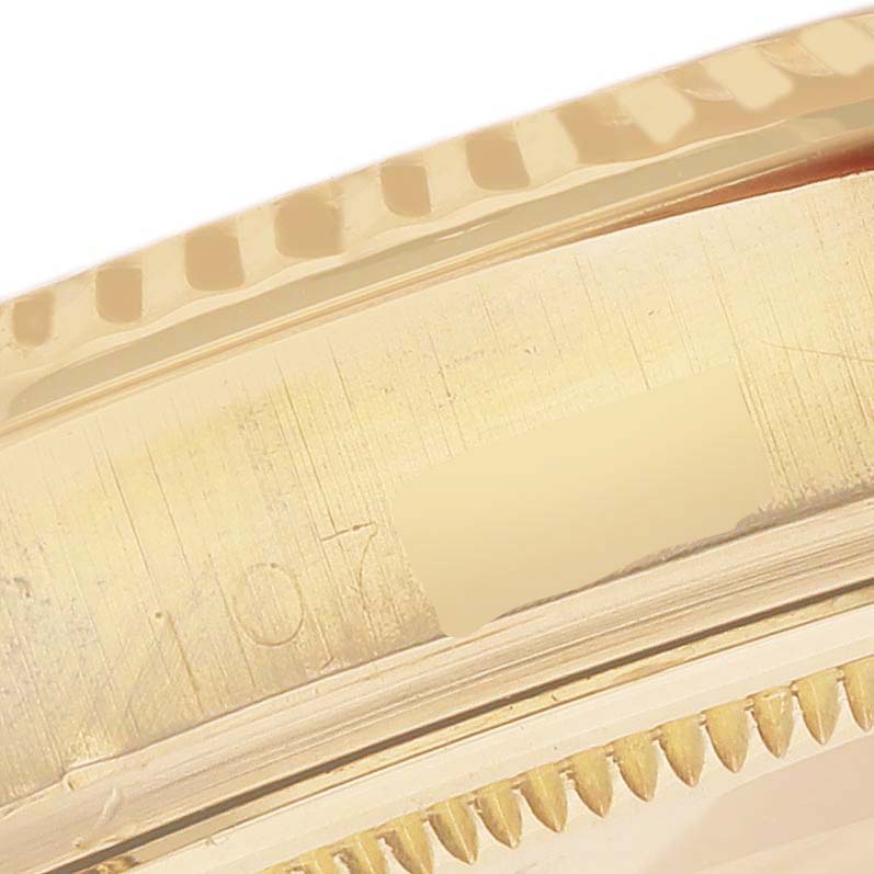 This close-up image shows the partial bezel and case side of a Rolex Vintage Collection 1803 Men's Yellow Gold Silver Dial 1803 Men's Yellow Gold Silver Dial watch.