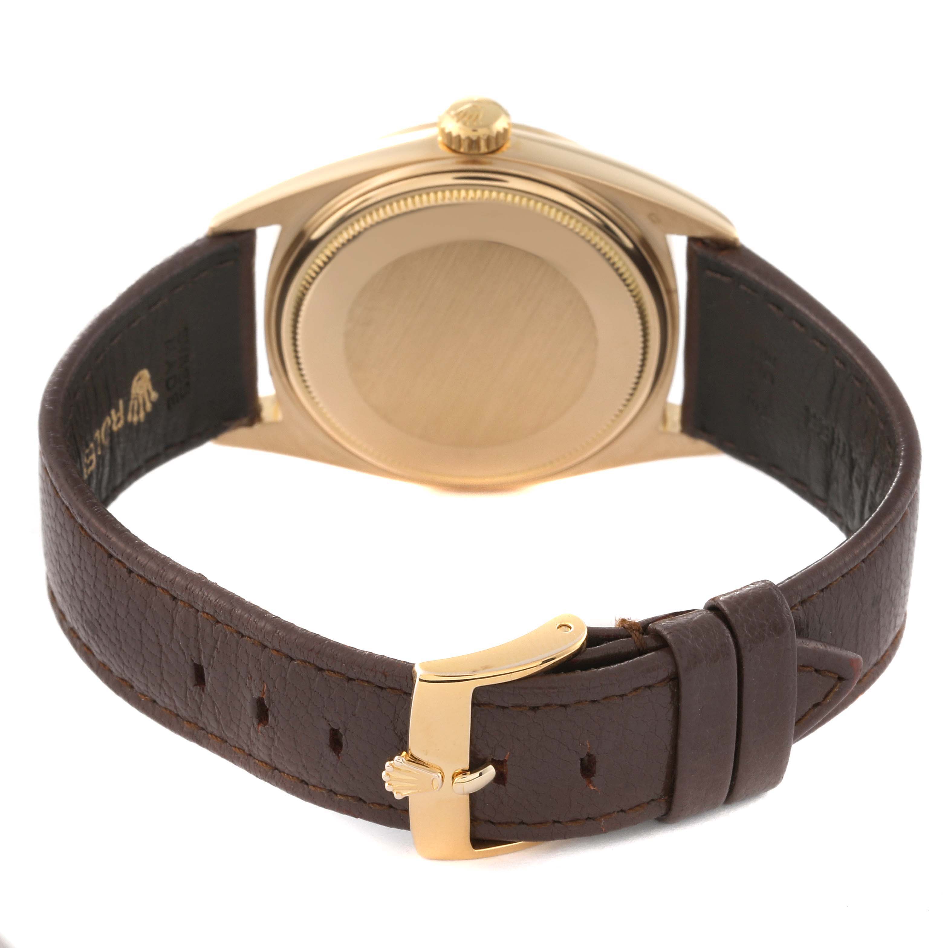 This image shows the back and the brown leather strap of the Vintage Collection model by Rolex.