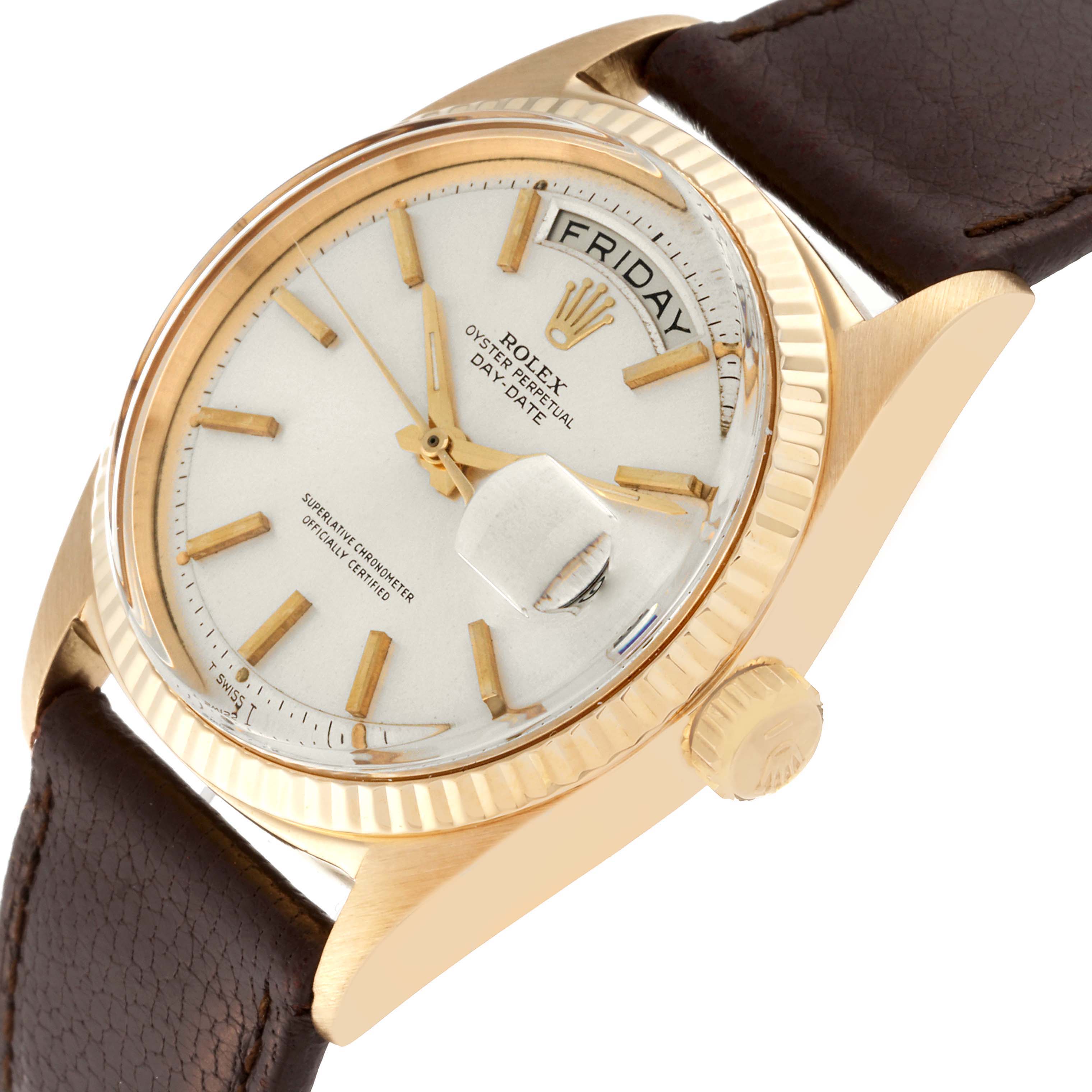 The image shows a close-up angle of a Rolex Vintage Collection 1803 Men's Yellow Gold Silver Dial 1803 Men's Yellow Gold Silver Dial Oyster Perpetual Day-Date watch, highlighting the dial, bezel, and part of the leather strap.