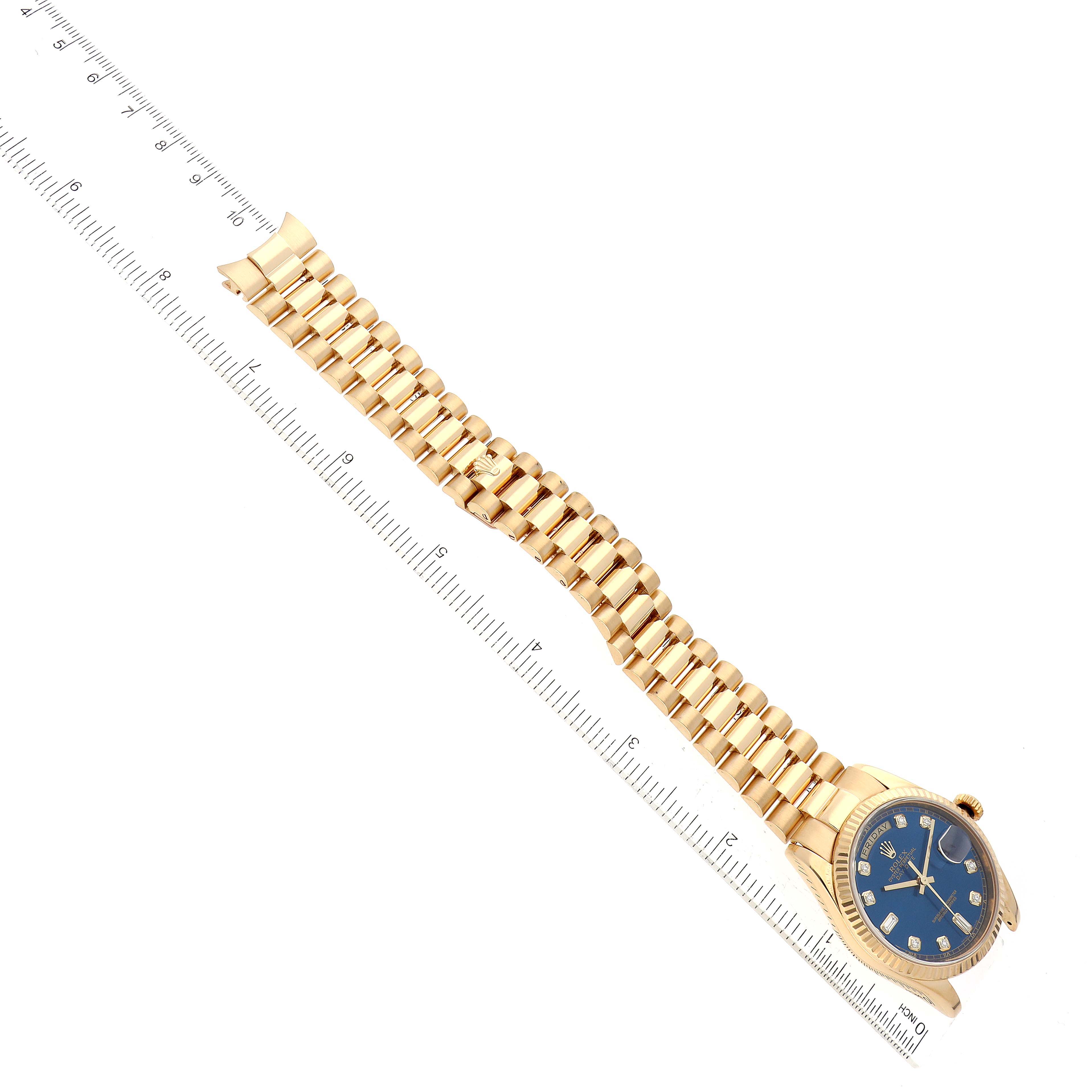 The Rolex President 118238 Men's Yellow Gold Blue Dial 118238 Men's Yellow Gold Blue Dial model watch is shown from an angled top-down view, displaying its gold bracelet and blue dial.
