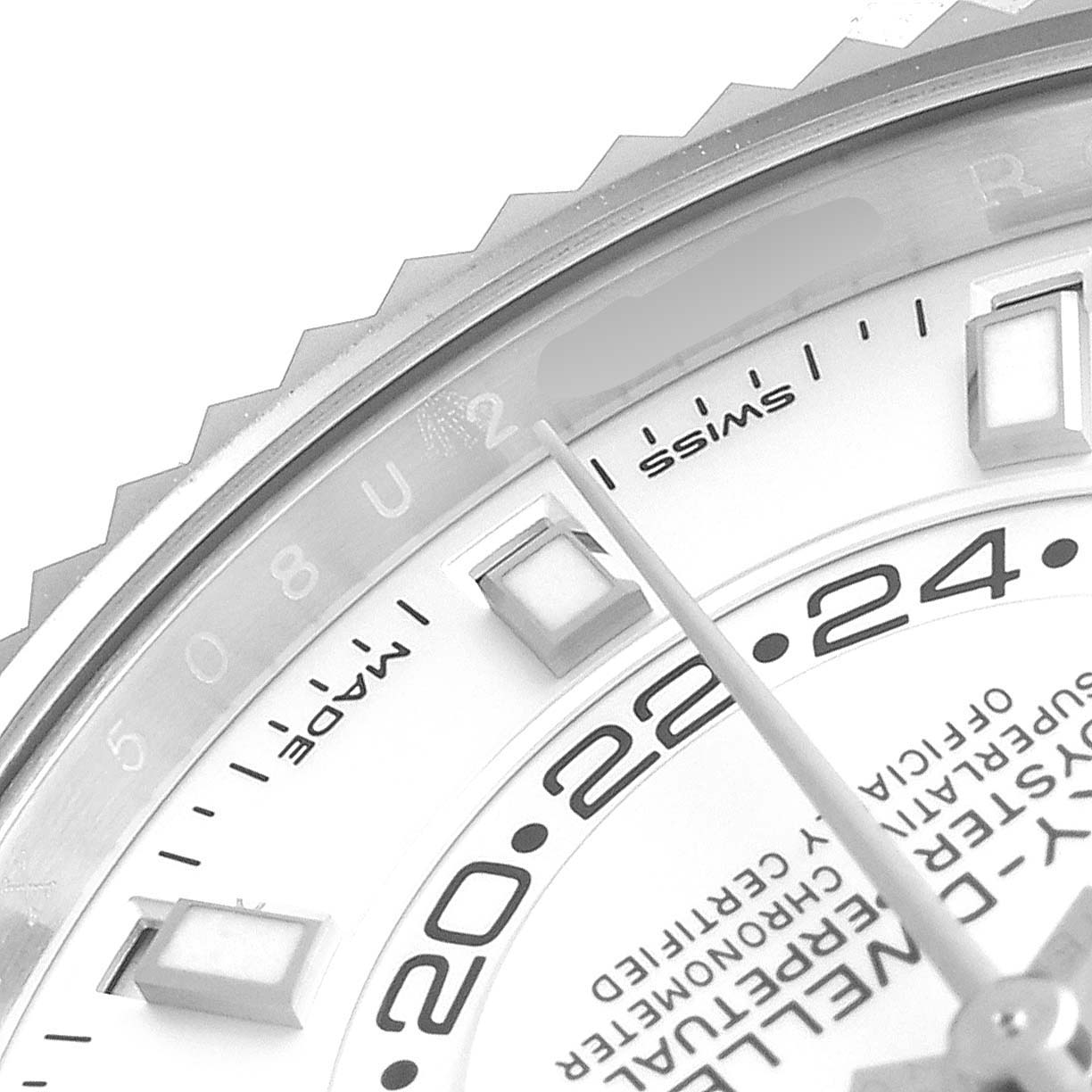 Close-up of the Rolex Sky-Dweller 326934 Men's Stainless Steel White Dial 326934 Men's Stainless Steel White Dial showing a partial view of the dial, bezel, and hour markers.