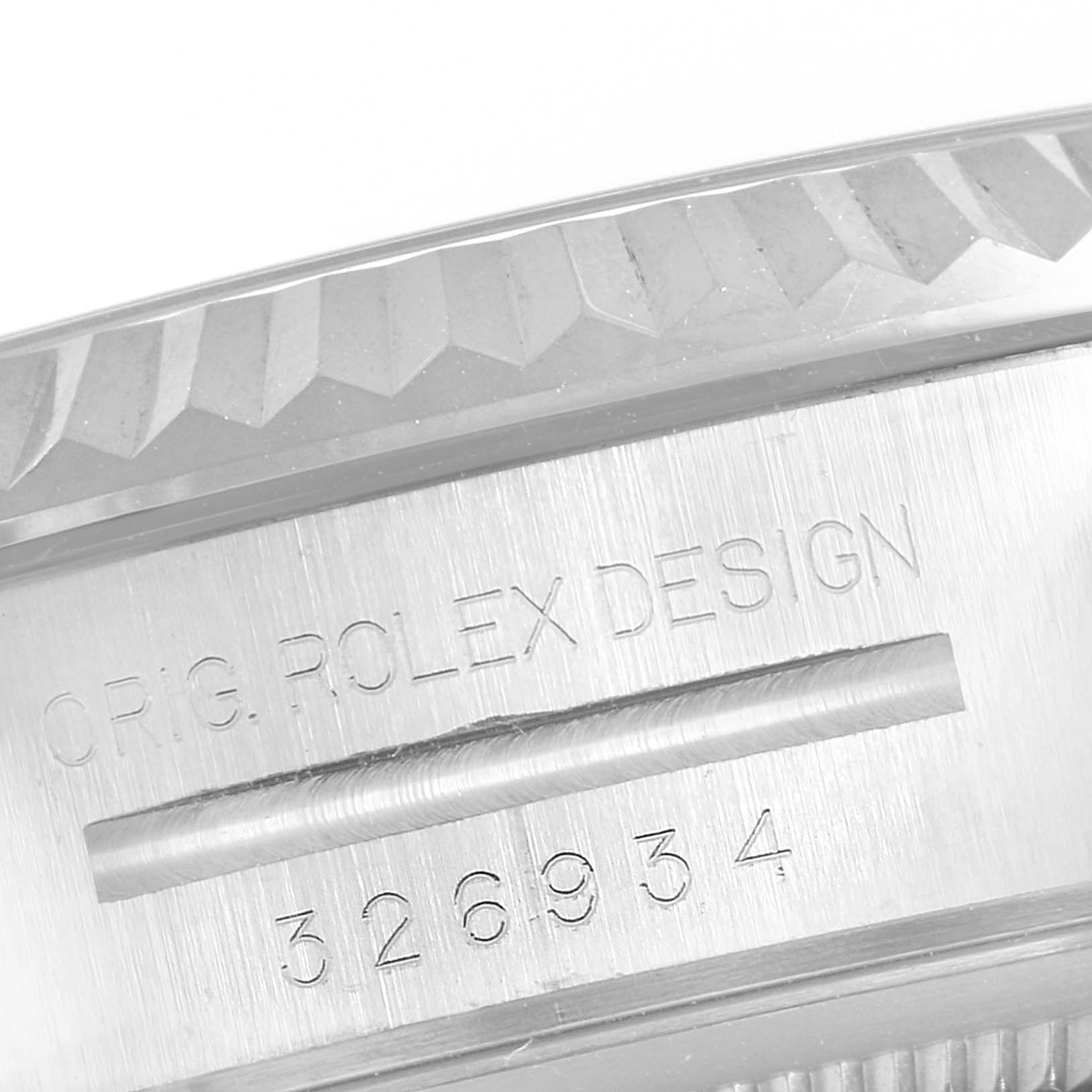 The image shows a close-up of the side of the Rolex Sky-Dweller 326934 Men's Stainless Steel White Dial 326934 Men's Stainless Steel White Dial watch, focusing on the case with engravings of its design and model number.