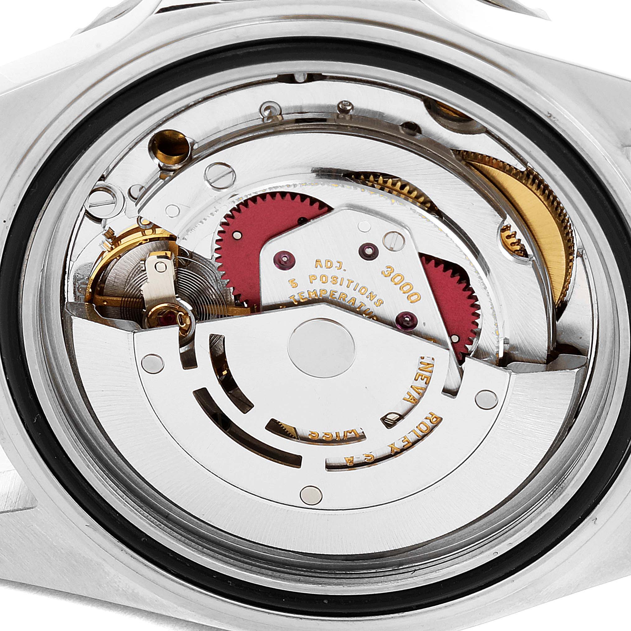 The image shows the internal mechanism of a Rolex Submariner 14060 Men's Stainless Steel Black Dial 14060 Men's Stainless Steel Black Dial watch from a rear angle, highlighting gears and the rotor.