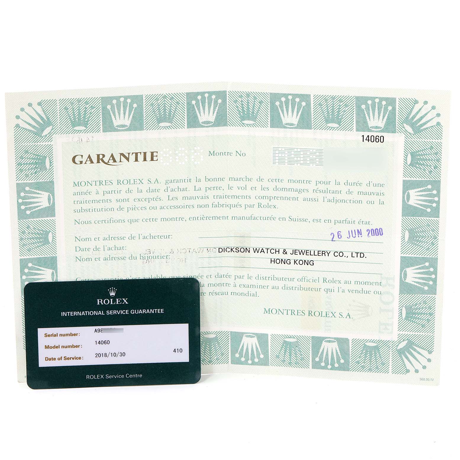 This image shows the warranty certificate and an international service guarantee card for a Rolex Submariner 14060 Men's Stainless Steel Black Dial 14060 Men's Stainless Steel Black Dial model.