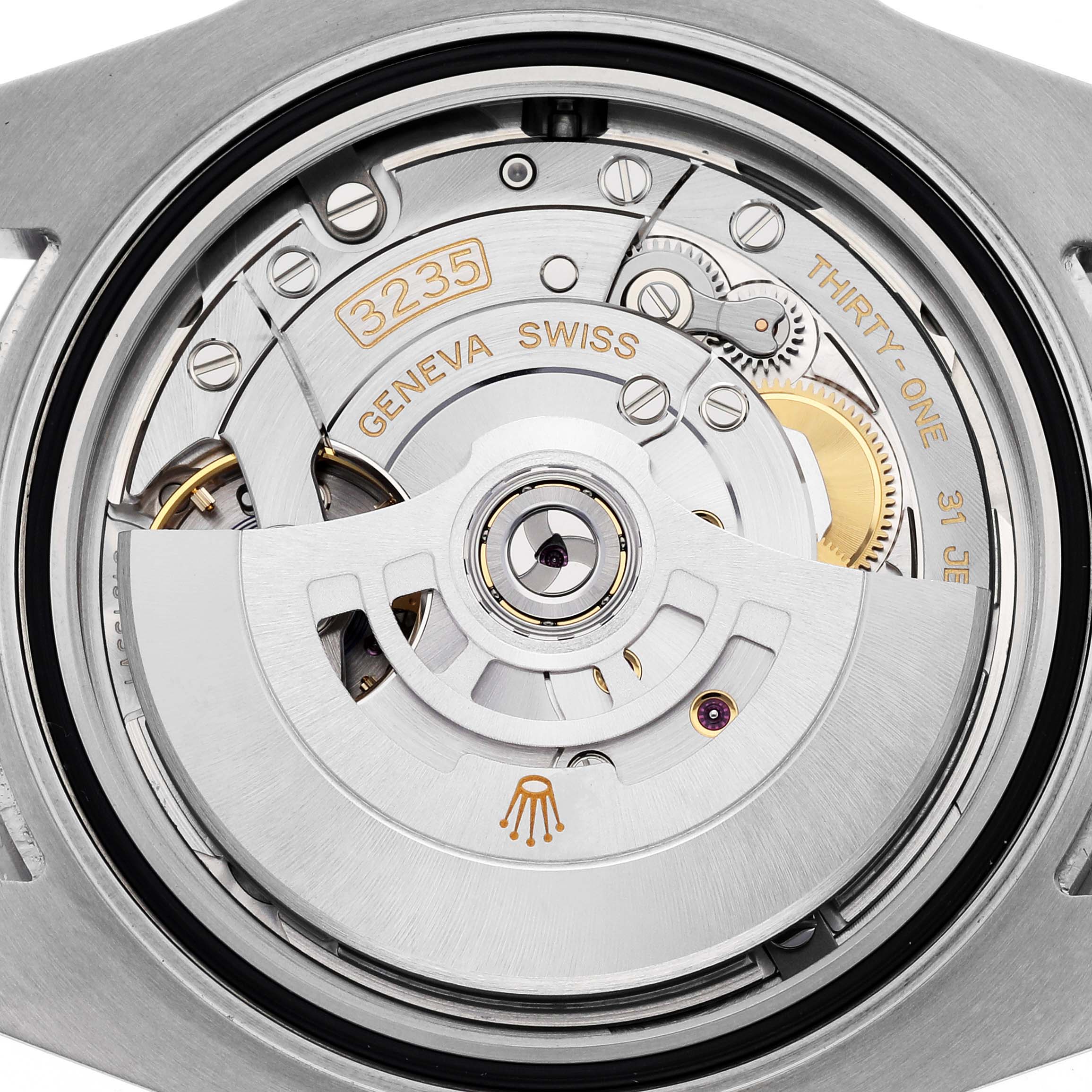 This image shows a close-up view of the movement mechanism inside a Rolex Submariner 126610LN Men's Stainless Steel Black Dial 126610LN Men's Stainless Steel Black Dial, featuring the caliber 3235.