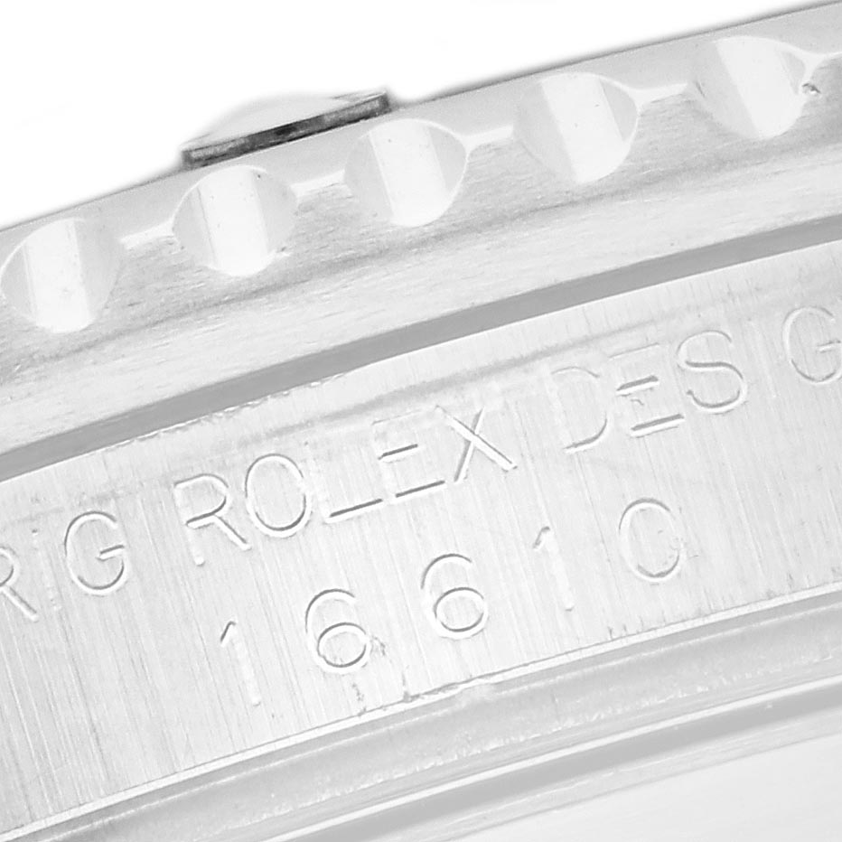 The image shows a close-up of the inner bezel of a Rolex Submariner 16610 Men's Stainless Steel Black Dial 16610 Men's Stainless Steel Black Dial, highlighting the engraved model number 16610.