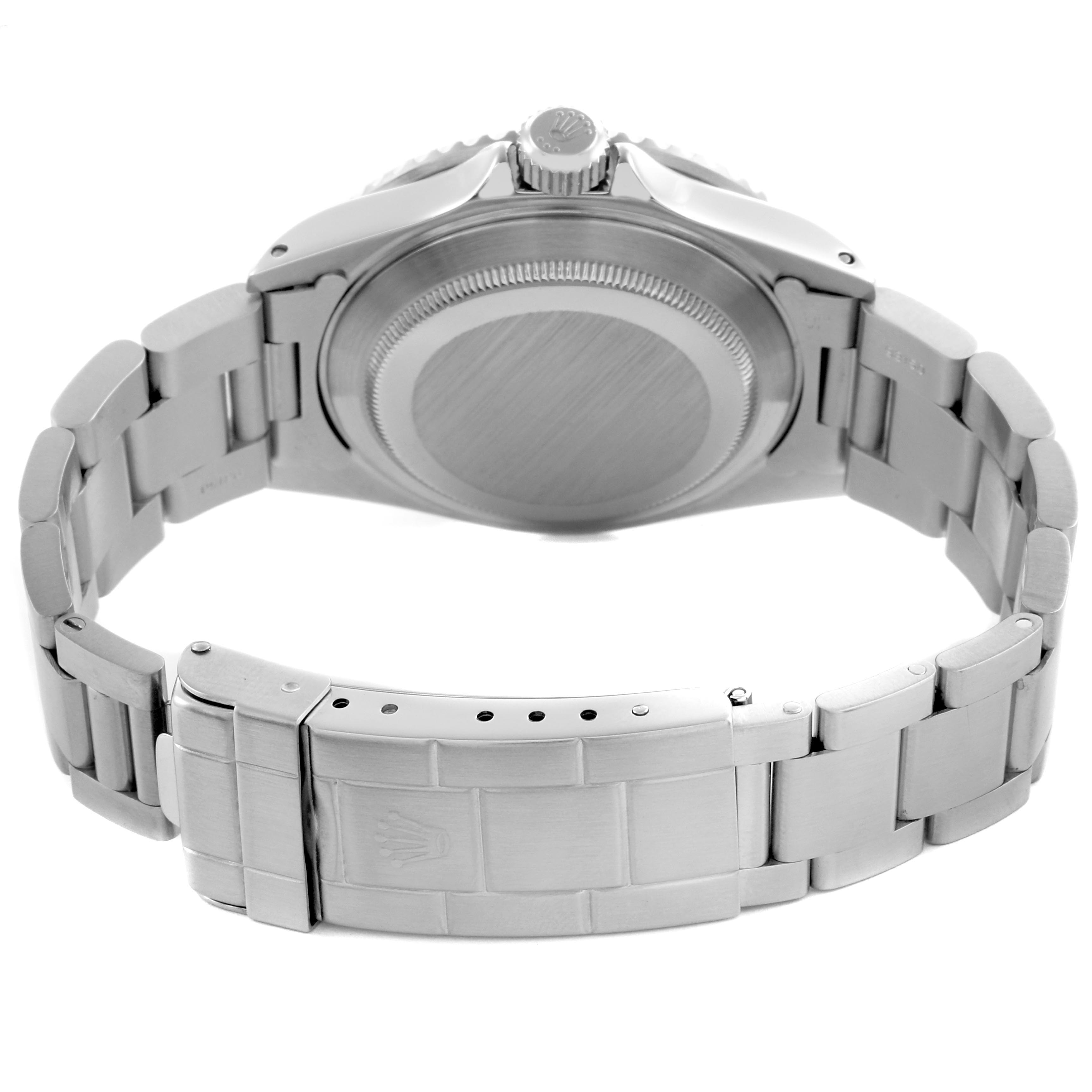 The image shows the back view of a Rolex Submariner 16610 Men's Stainless Steel Black Dial 16610 Men's Stainless Steel Black Dial, highlighting the case back, bracelet, and clasp.