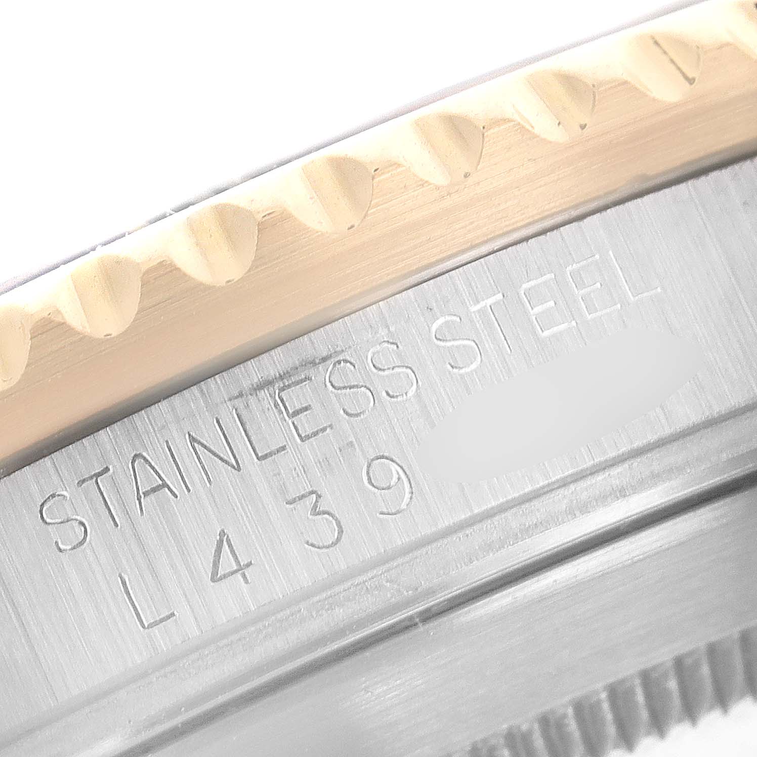 This image shows a close-up of the stainless steel case and bezel edge of a Rolex Submariner 16613 Men
s Steel and Gold (two tone) Champagne Dial 16613 Men
s Steel and Gold (two tone) Champagne Dial watch.