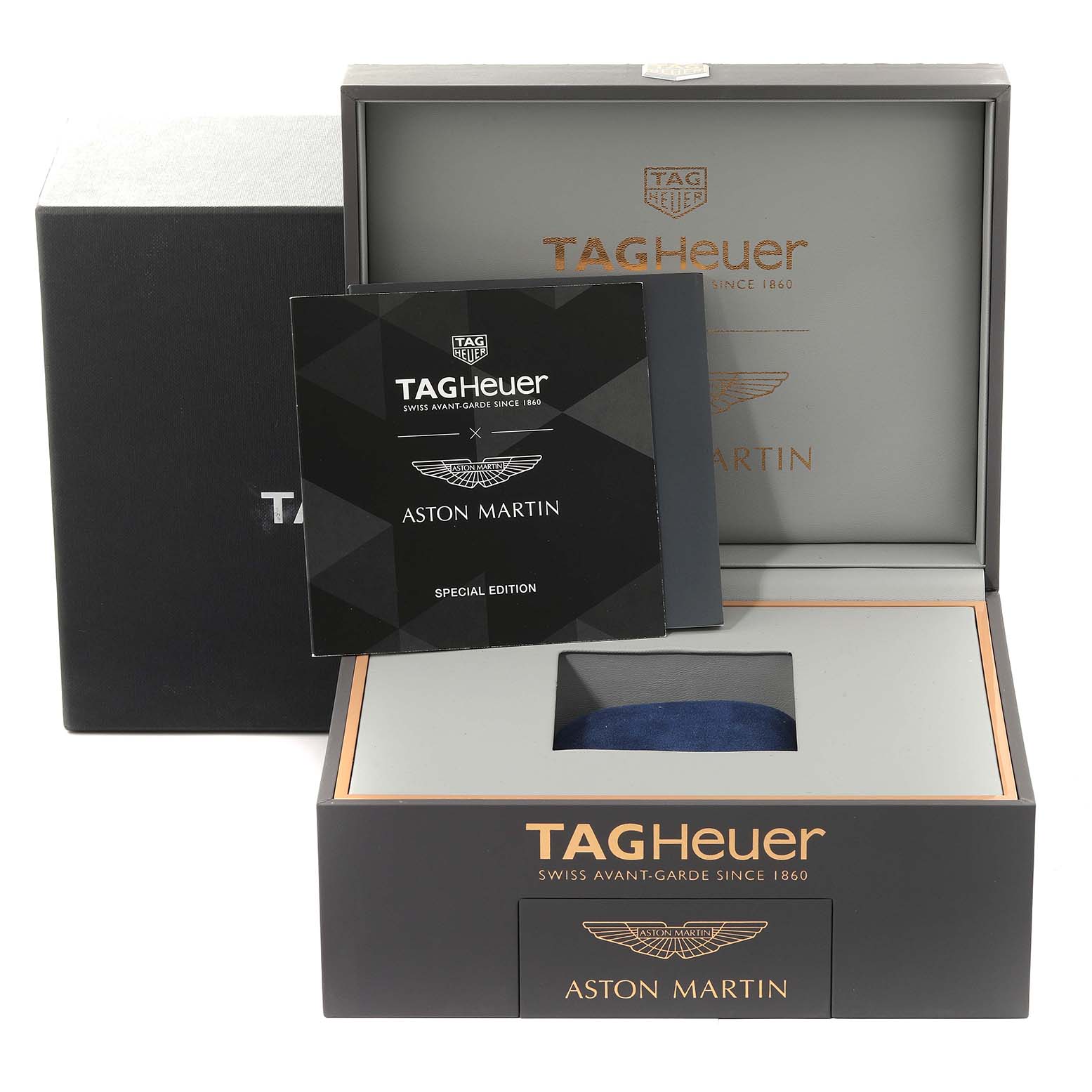 The image shows the packaging and manual for a Tag Heuer Carrera CAR2A1AB.FT6163 Men's Stainless Steel Black Dial CAR2A1AB.FT6163 Men's Stainless Steel Black Dial Aston Martin Special Edition watch.