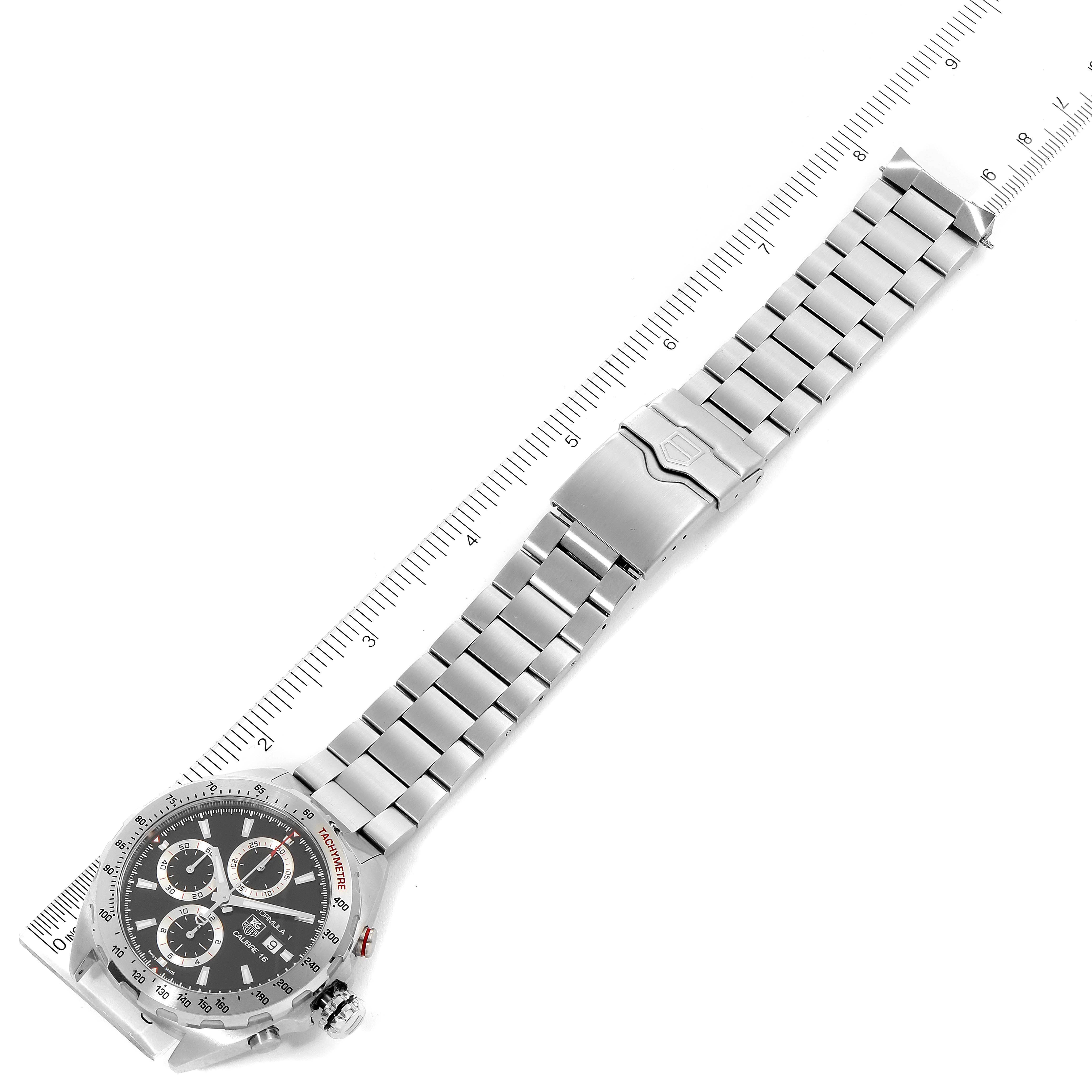The image shows a Tag Heuer Formula 1 CAZ2010.BA0876 Men's Stainless Steel Black Dial CAZ2010.BA0876 Men's Stainless Steel Black Dial watch laid flat, displaying the watch face, metal bracelet, and clasp from an overhead angle.