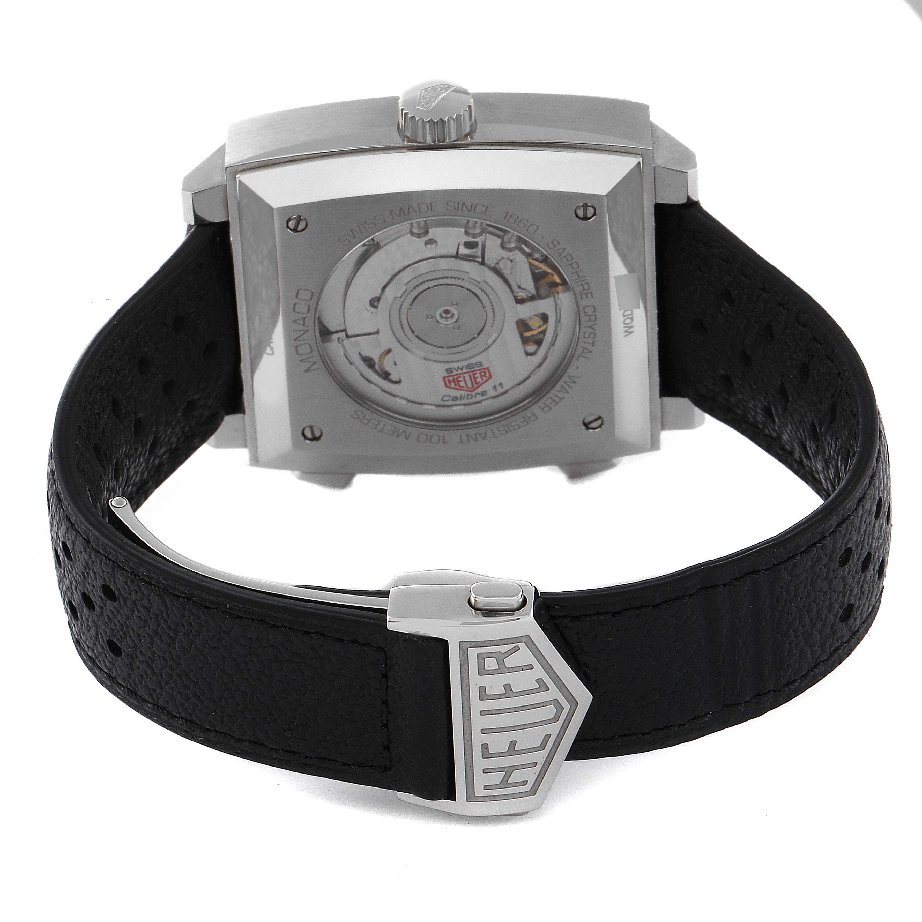 The image shows the back of the Tag Heuer Monaco CAW211P Men
s Stainless Steel Blue Dial CAW211P Men
s Stainless Steel Blue Dial watch, highlighting its movement and leather strap with the Heuer logo.