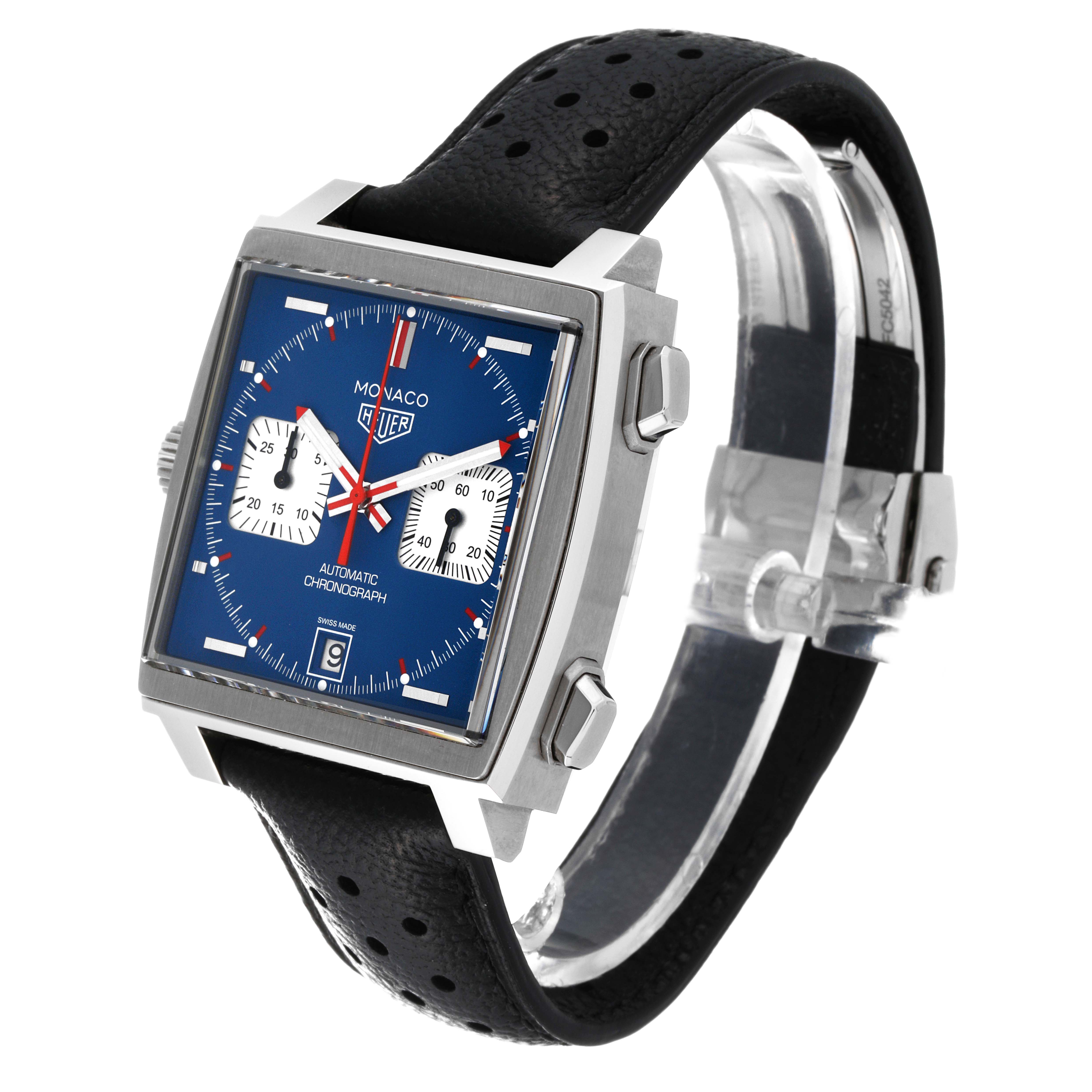 The image shows a side angle of the Tag Heuer Monaco CAW211P Men
s Stainless Steel Blue Dial CAW211P Men
s Stainless Steel Blue Dial watch, highlighting its blue square face, chronograph buttons, and black perforated strap.
