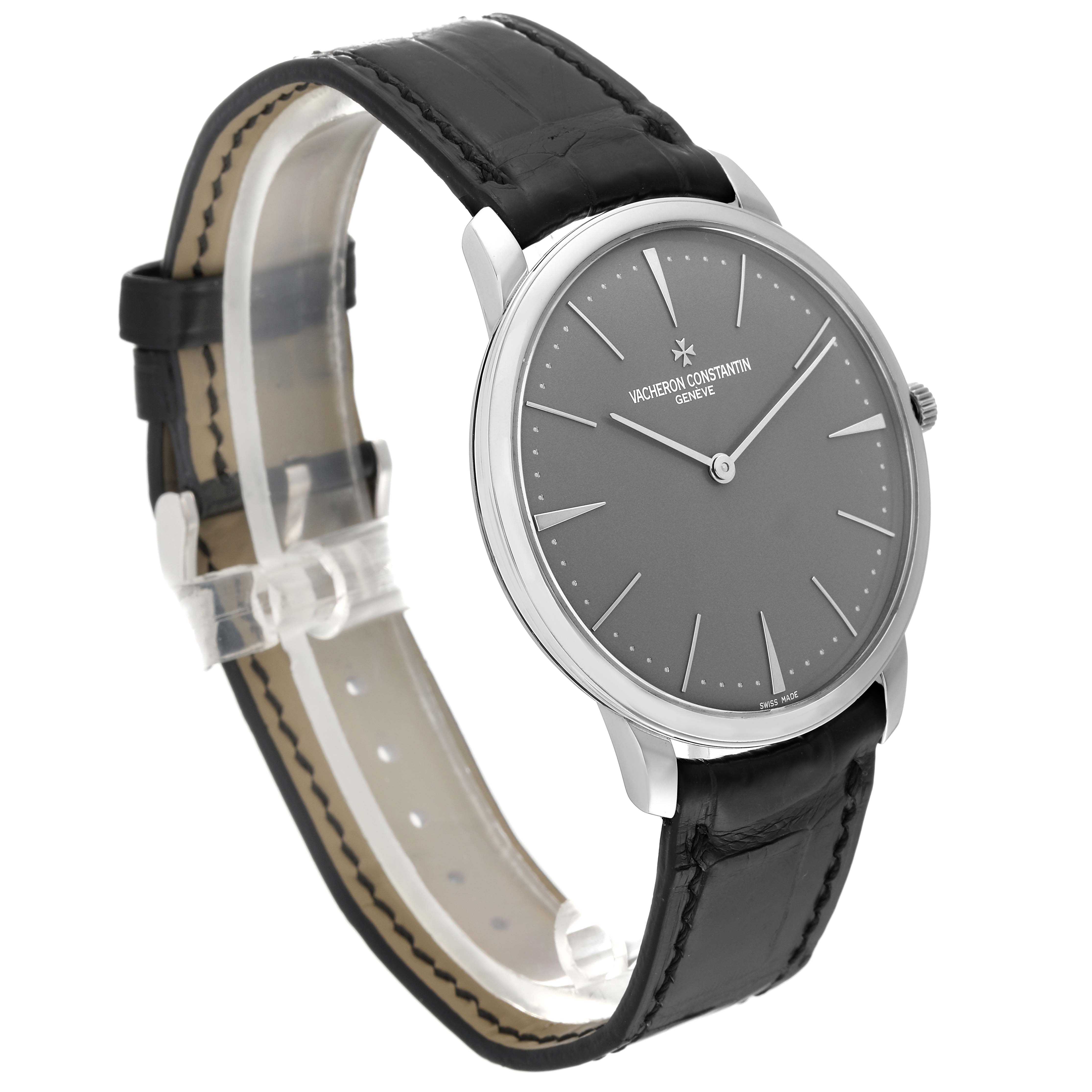 The image shows a side-angle view of a Vacheron Constantin Patrimony 81180/000P-9539 Men's Platinum Grey Dial 81180/000P-9539 Men's Platinum Grey Dial watch with a gray dial and black leather strap.