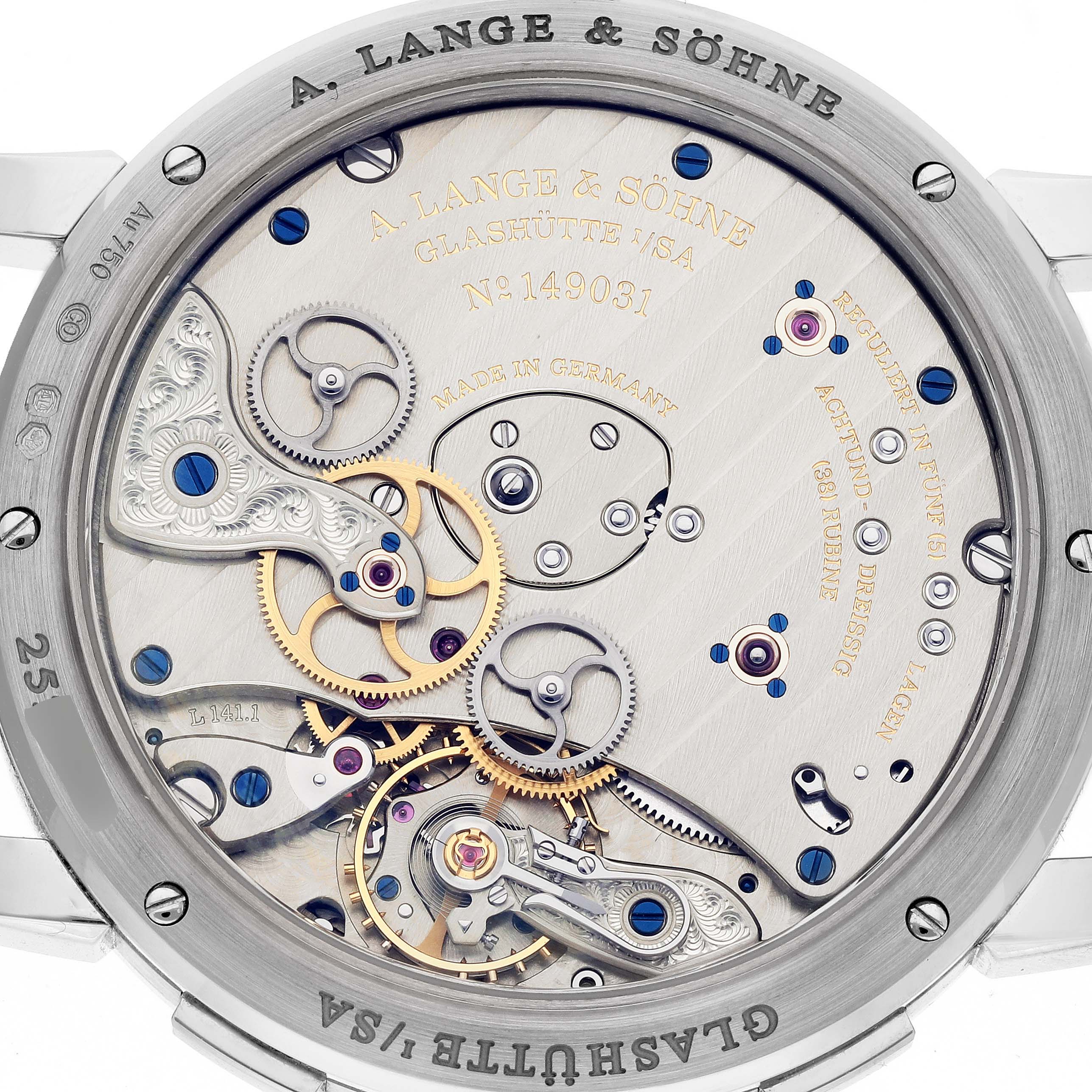 The image shows the intricate back case and inner mechanism of the A. Lange & Sohne Lange 1 136.029 Men's White Gold Black Dial watch.