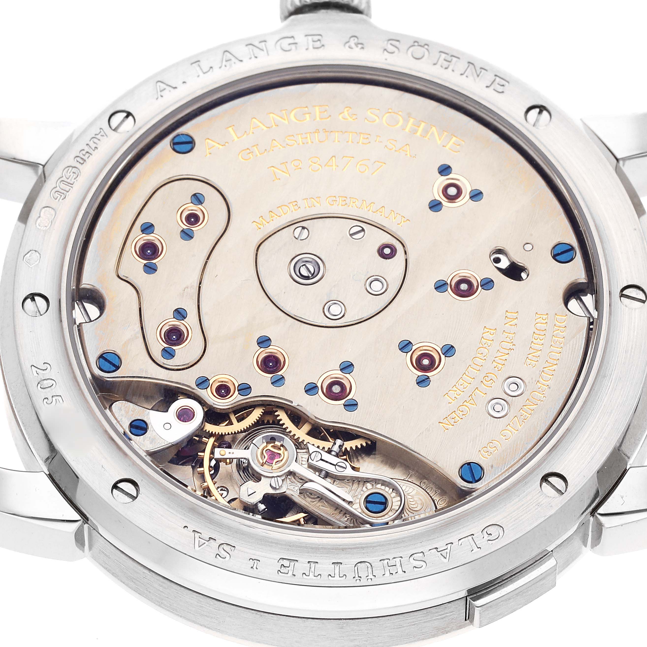 The image shows the back angle of the Lange 1 model by A. Lange & Söhne, revealing its intricate movement and internal components.