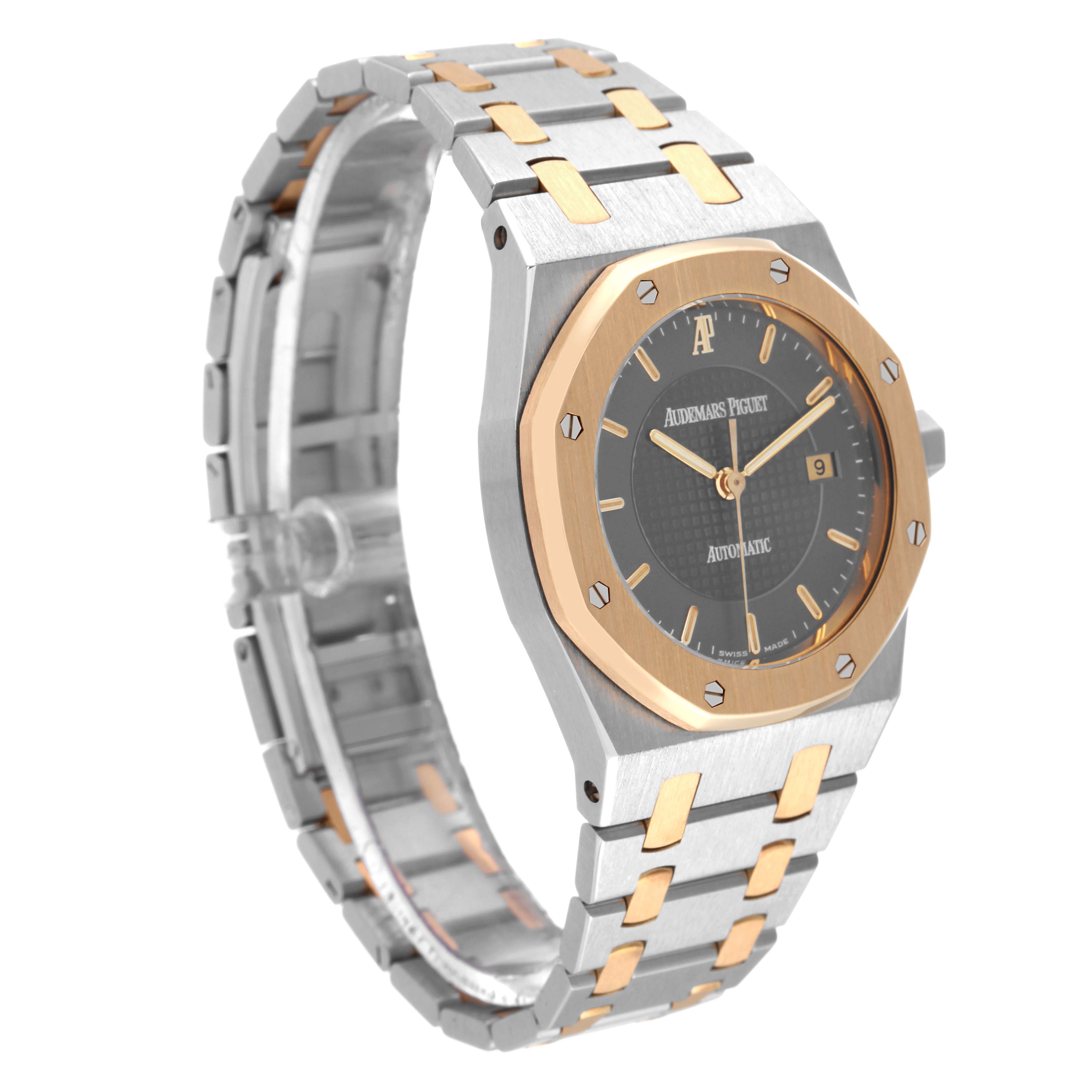 The image shows a side view of the Audemars Piguet Royal Oak 15050SA.O.0789SA.01 Men's Steel and Gold (two tone) Grey Dial 15050SA.O.0789SA.01 Men's Steel and Gold (two tone) Grey Dial watch, highlighting the face, bezel, and part of the bracelet.