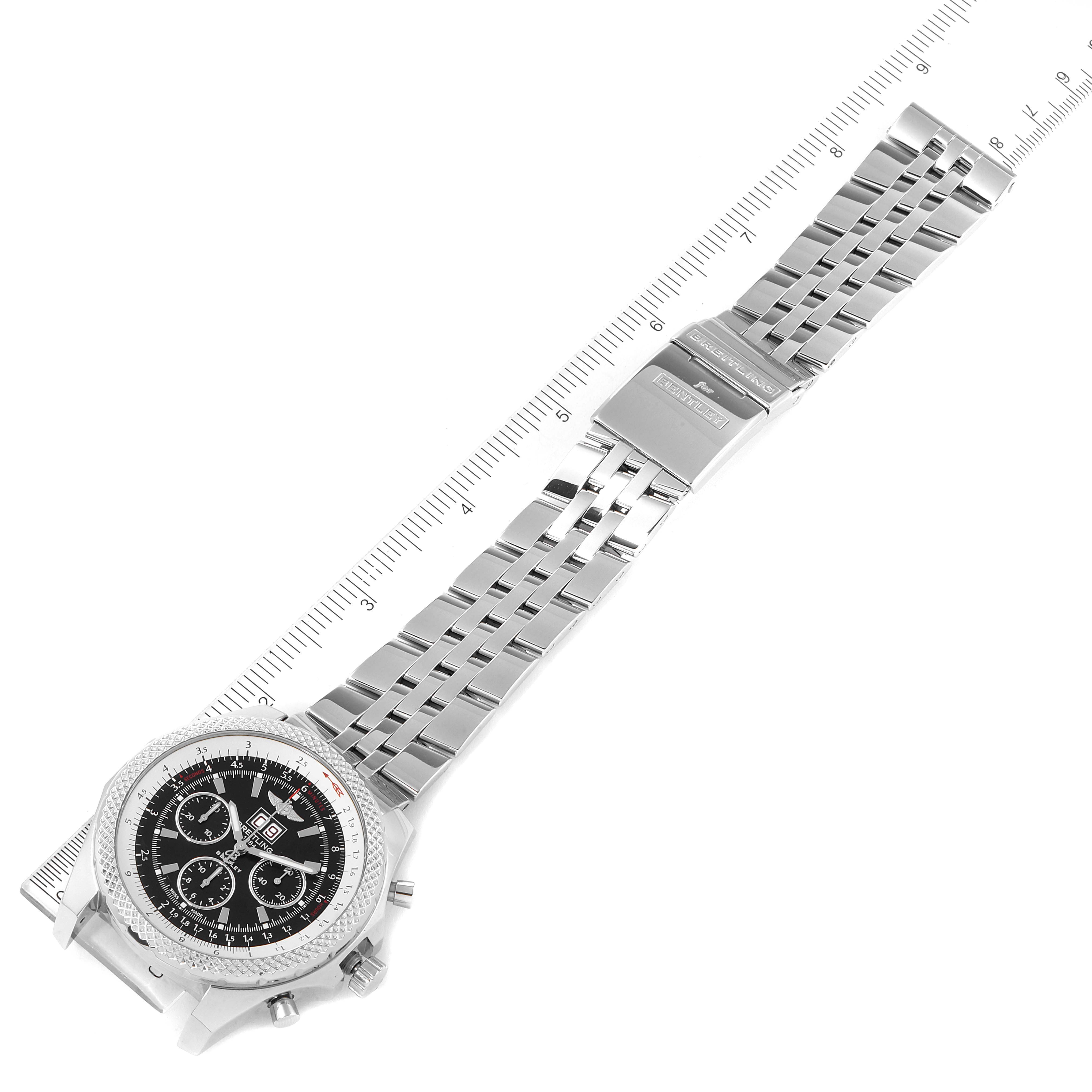 The image shows a top-down view of a Breitling Bentley A44364 Men's Stainless Steel Black Dial A44364 Men's Stainless Steel Black Dial watch, including its face, bezel, and metal bracelet with a ruler for scale.
