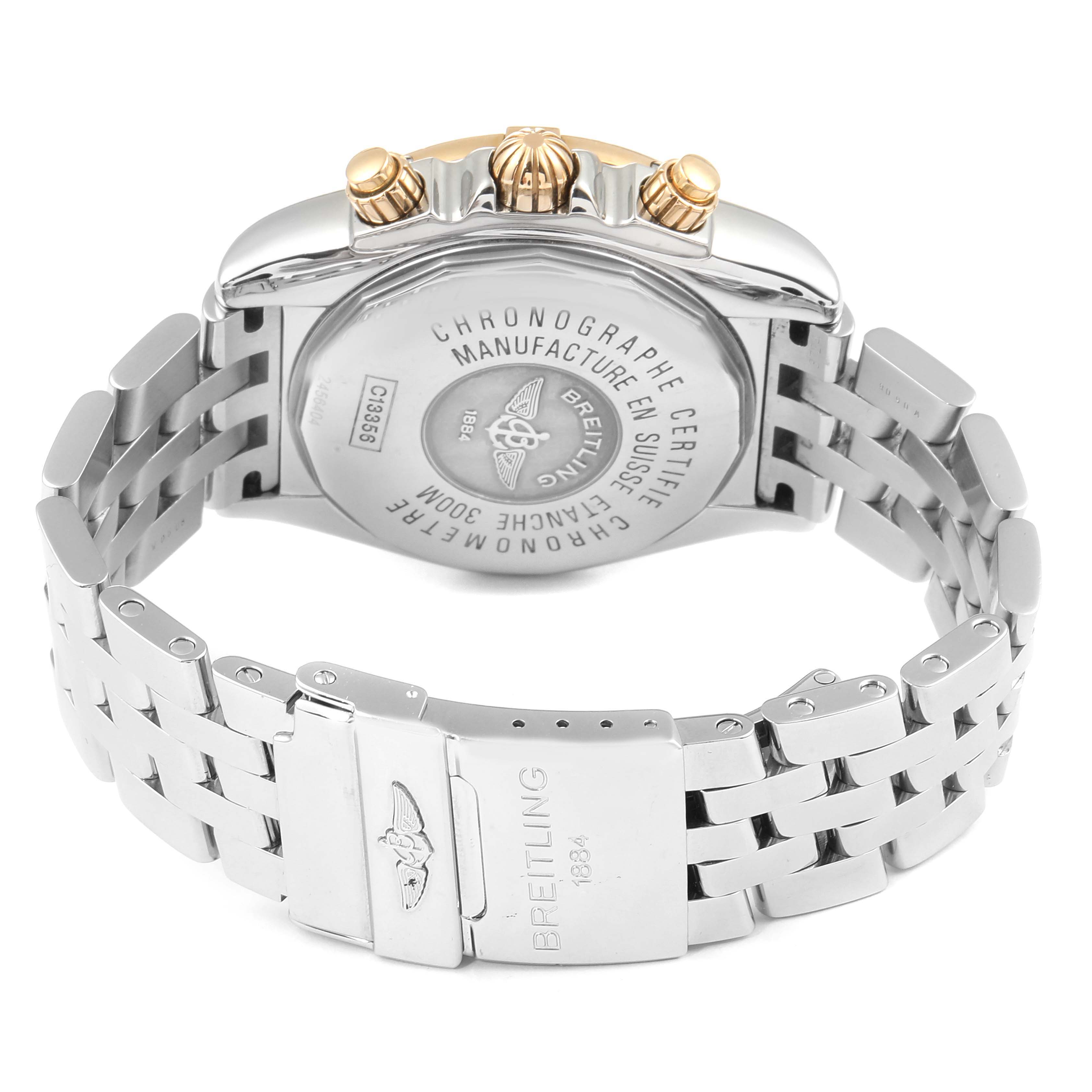 The image shows the back view of a Breitling Chronomat C13356 Men's Steel and Gold (two tone) White Dial C13356 Men's Steel and Gold (two tone) White Dial watch, showcasing its case back, crown, pushers, and metal bracelet with clasp.