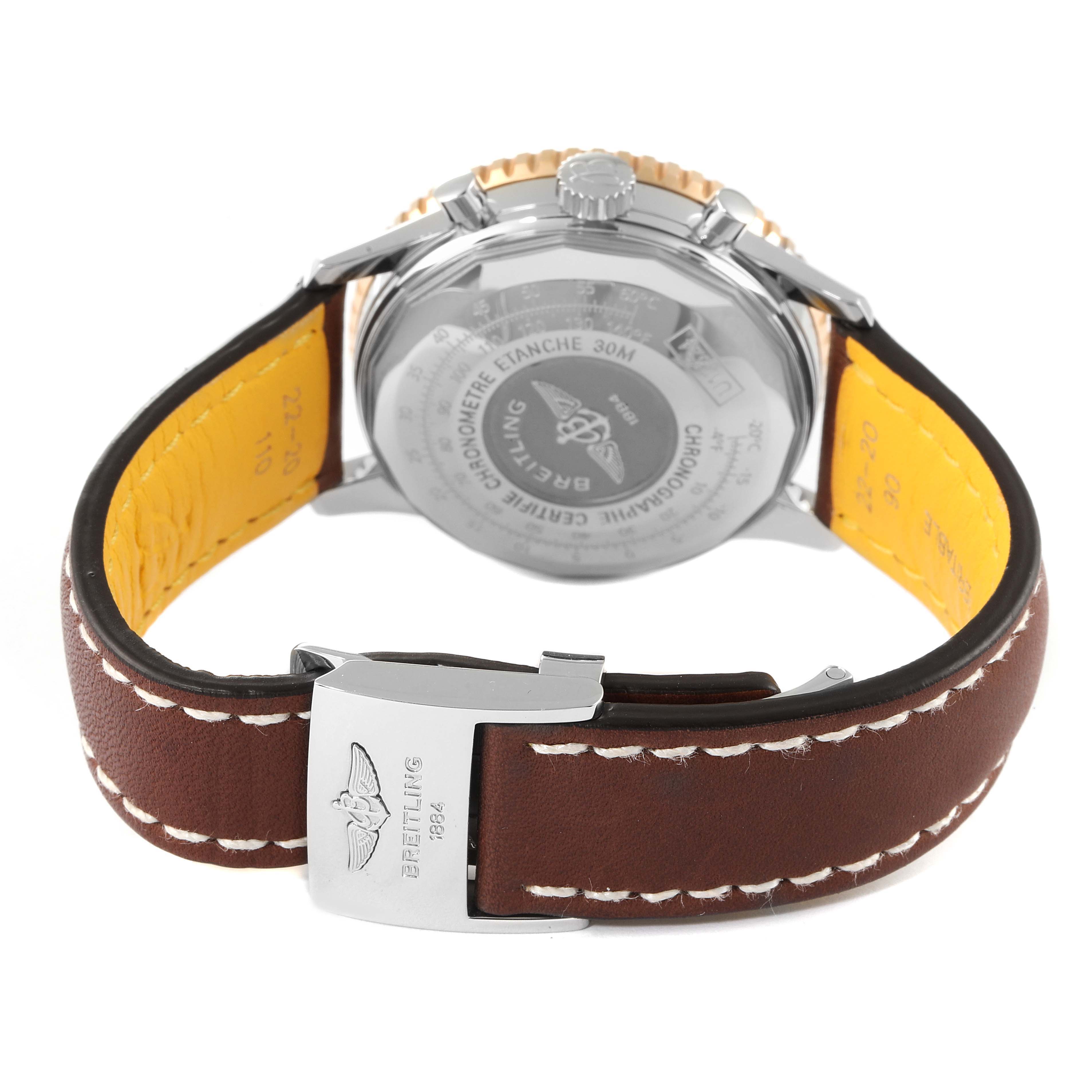 The image shows the rear view of a Breitling Navitimer U13324211B1X1 Men
s Steel and Gold (two tone) Black Dial U13324211B1X1 Men
s Steel and Gold (two tone) Black Dial watch, detailing the case back, crown, and leather strap with the clasp.