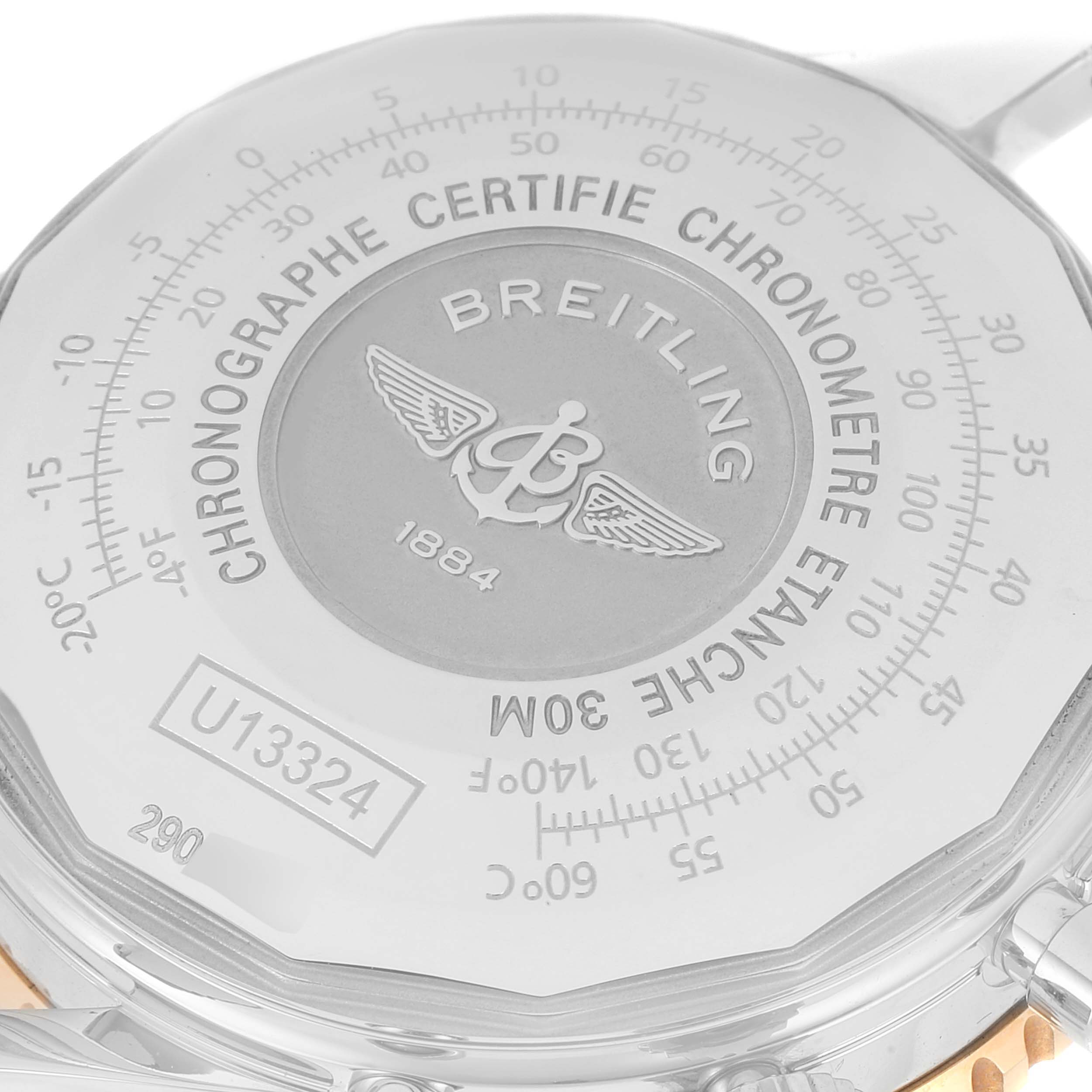 The image shows the back case of the Breitling Navitimer U13324211B1X1 Men
s Steel and Gold (two tone) Black Dial U13324211B1X1 Men
s Steel and Gold (two tone) Black Dial watch, highlighting the engraved logo and certification details.