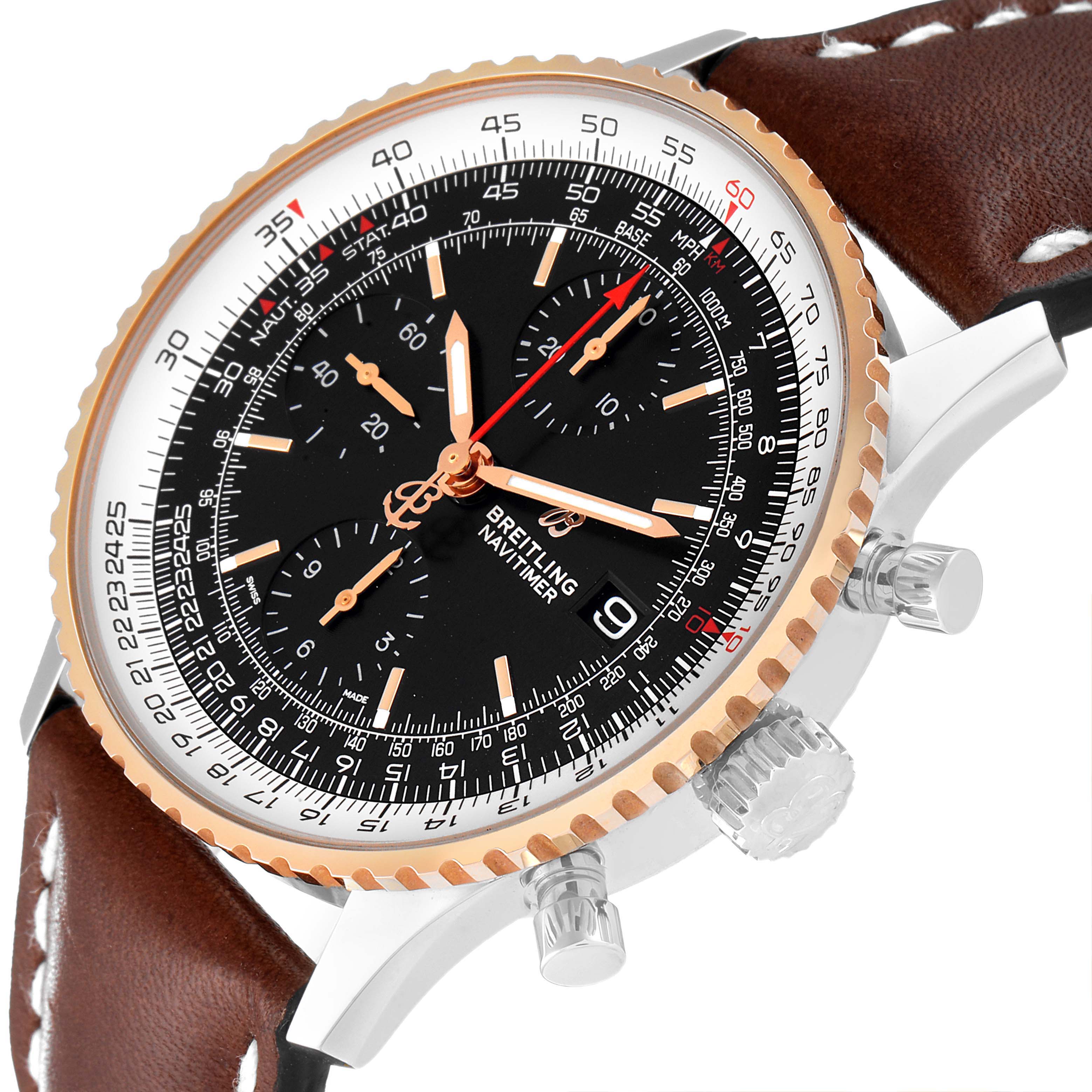The image shows a Breitling Navitimer U13324211B1X1 Men
s Steel and Gold (two tone) Black Dial U13324211B1X1 Men
s Steel and Gold (two tone) Black Dial watch at a tilted angle, focusing on the dial, bezel, crown, and leather strap.