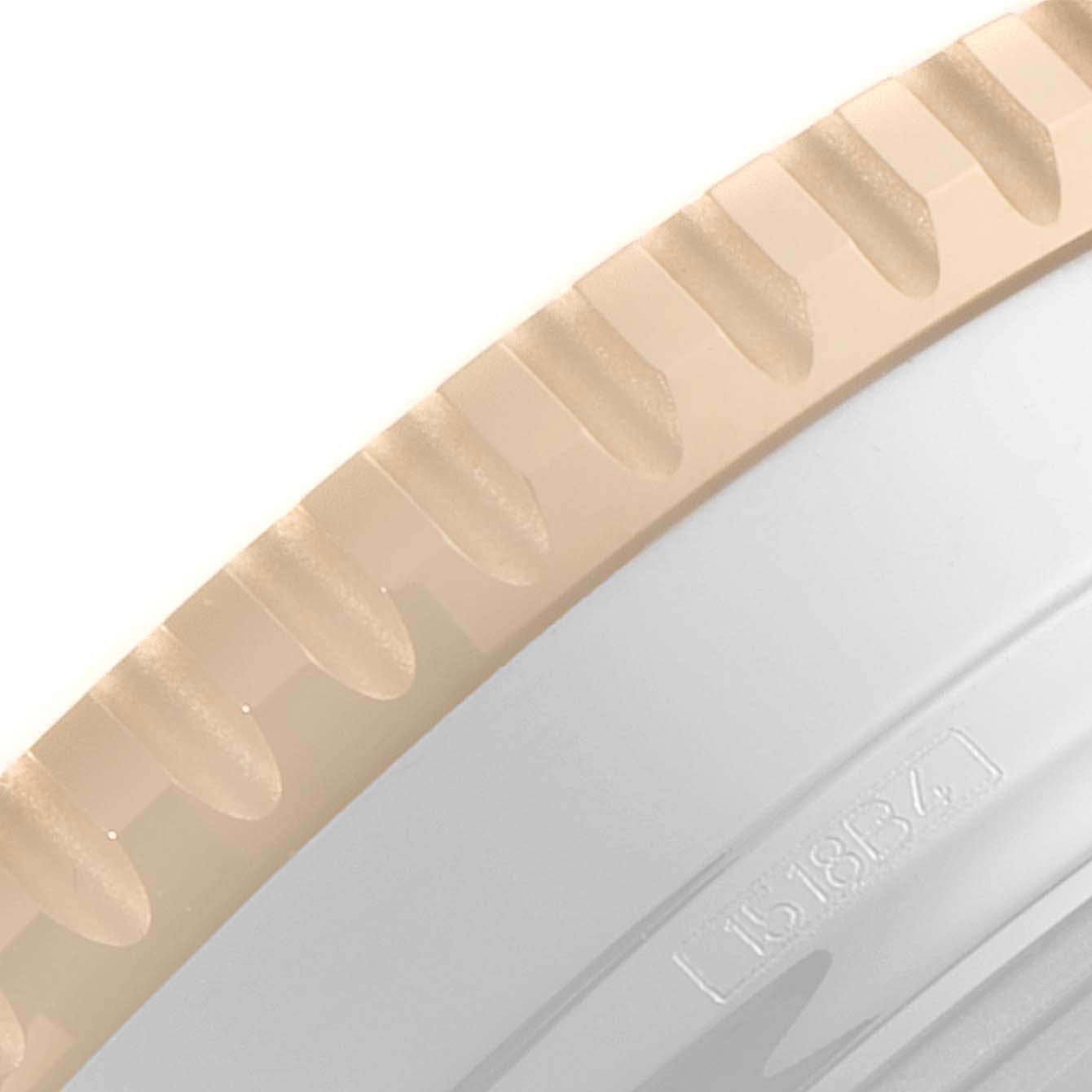 The image shows a close-up of the engraved edge of the bezel and part of the case back of the Breitling Navitimer U13324211B1X1 Men
s Steel and Gold (two tone) Black Dial U13324211B1X1 Men
s Steel and Gold (two tone) Black Dial watch.