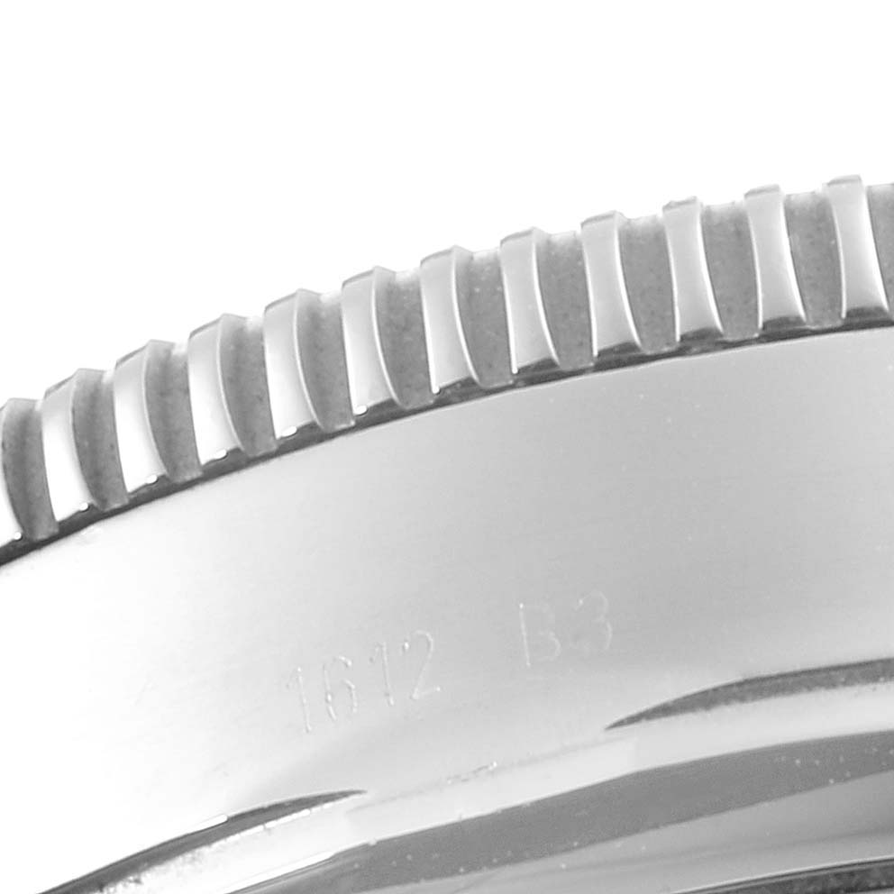 This image shows a close-up of the stainless steel bezel of a Breitling Superocean A13320 Men
s Stainless Steel Silver Dial A13320 Men
s Stainless Steel Silver Dial watch.