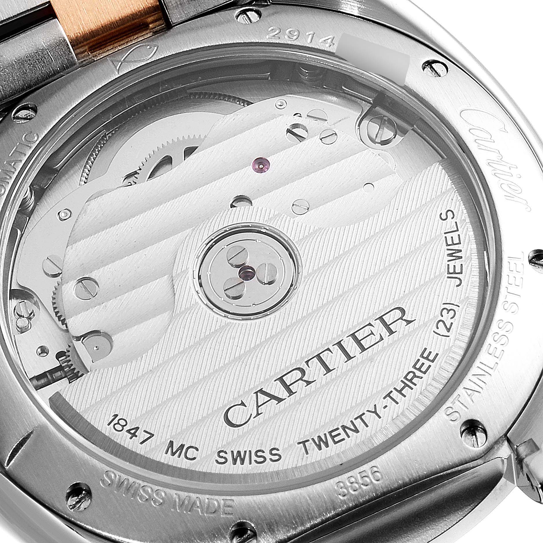 The image shows the back of a Cartier Cle W2CL0003 Women
s Steel and Gold (two tone) Silver Dial W2CL0003 Women
s Steel and Gold (two tone) Silver Dial model watch, highlighting its automatic movement and details such as jewel count and Swiss origin.