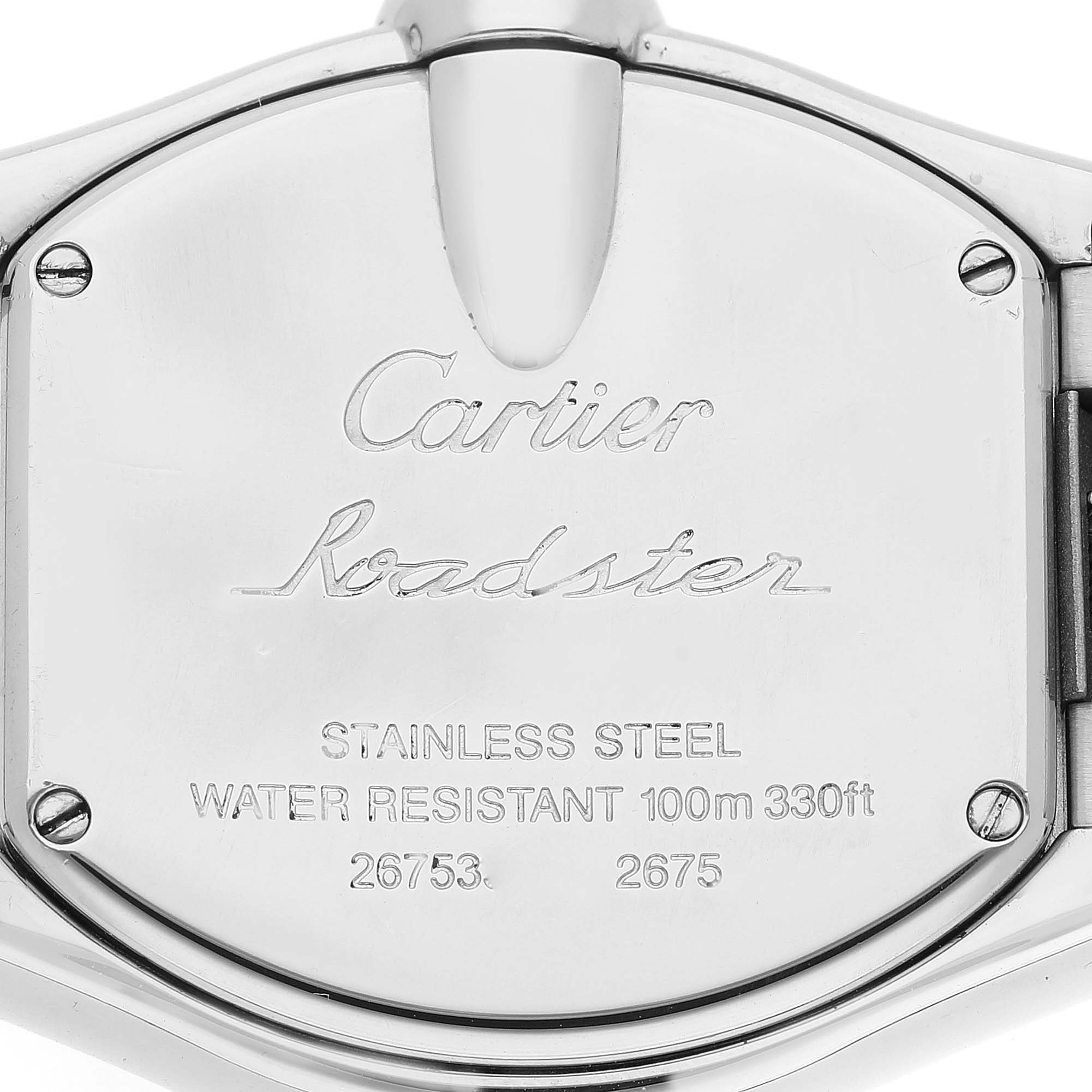 The image shows a close-up view of the stainless steel back case of a Cartier Roadster W62016V3 Women's Stainless Steel Silver Dial W62016V3 Women's Stainless Steel Silver Dial watch.